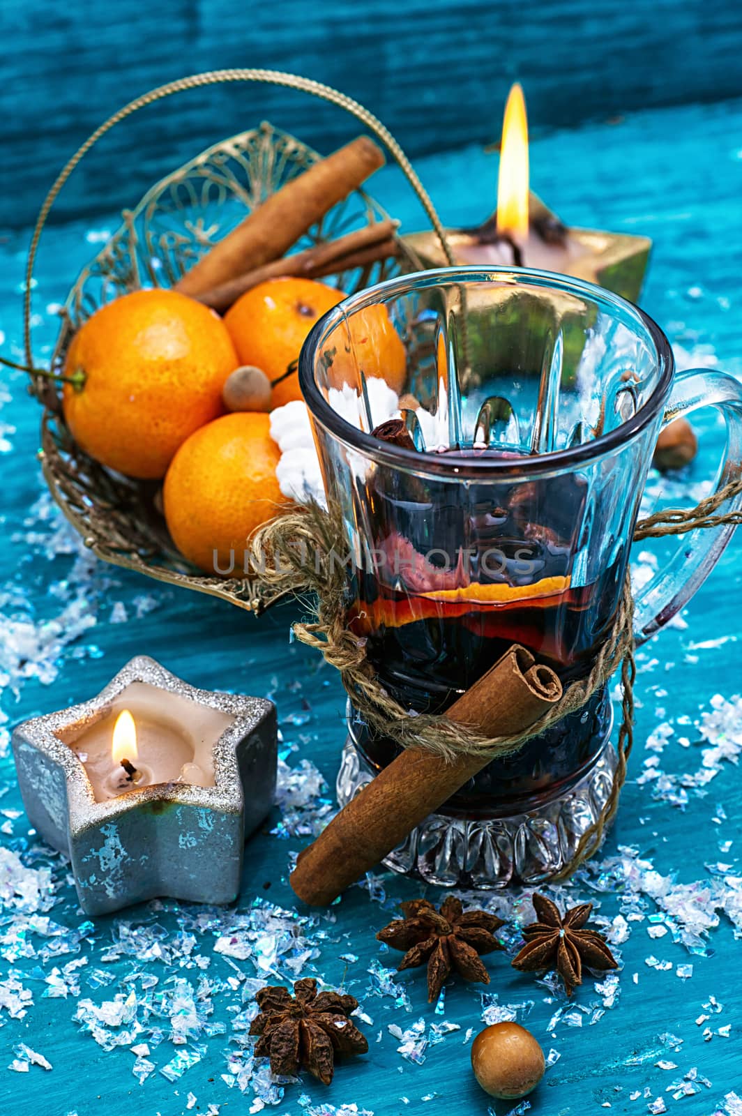 drink mulled wine on bright blue background. by LMykola