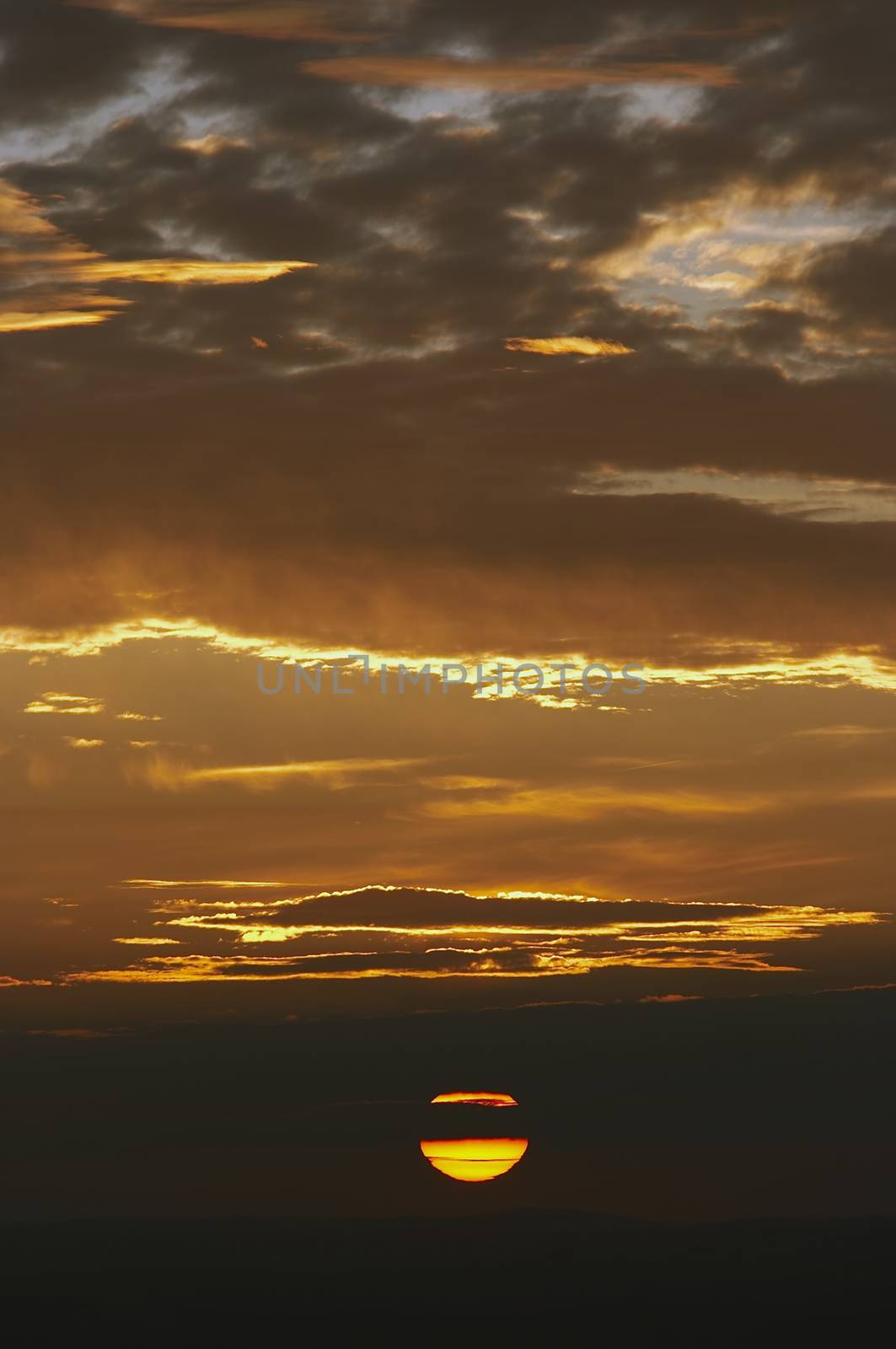 Shot of the sky and setting sun on the horizon