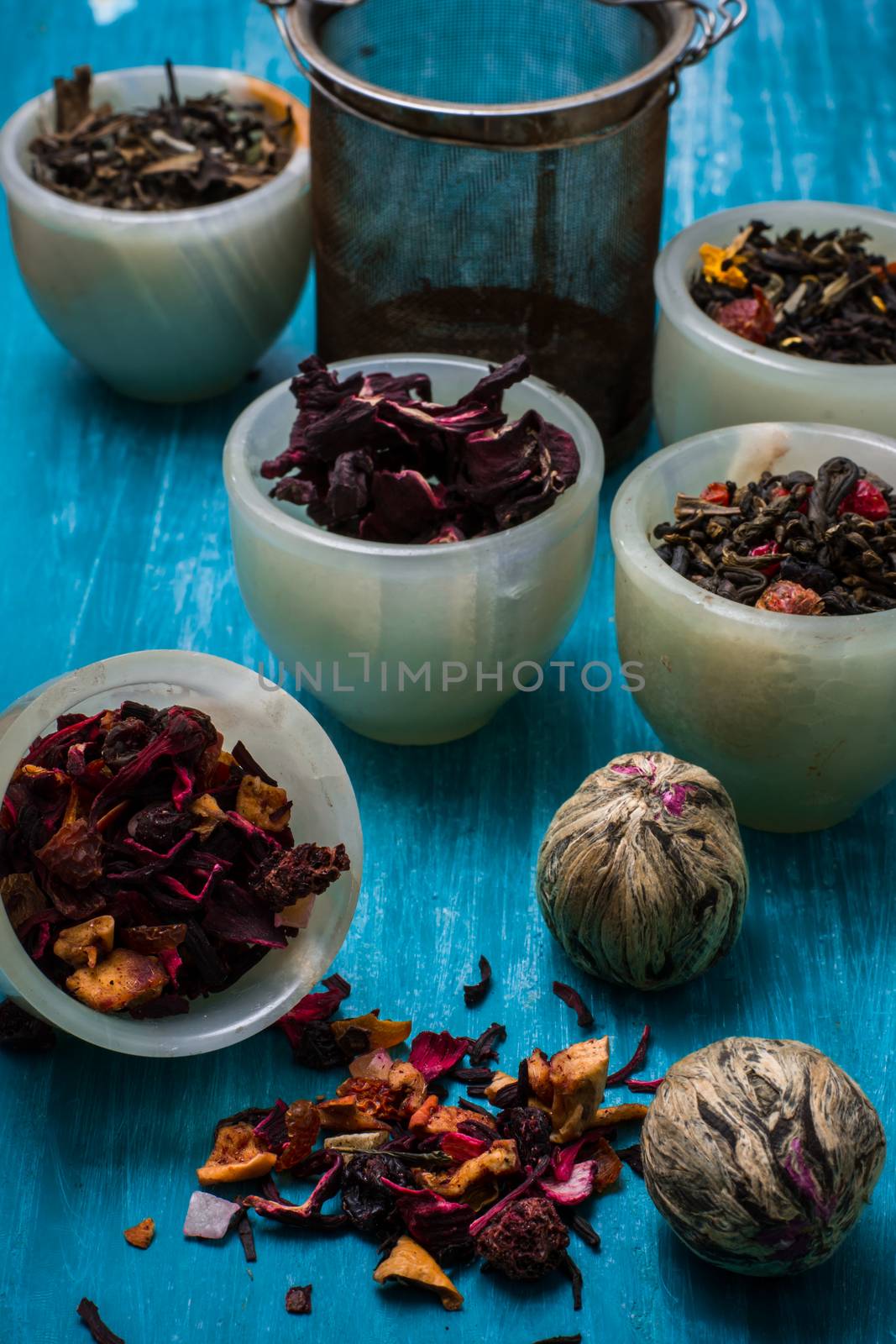 dried tea leaves for brewing tea on wooden table