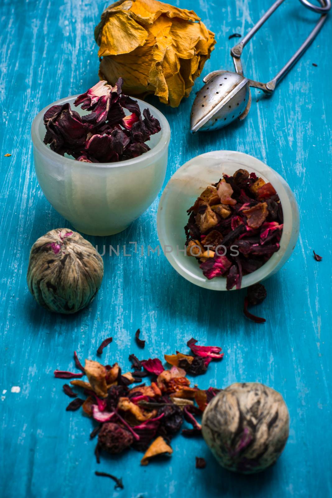 dried tea leaves for brewing tea on wooden table