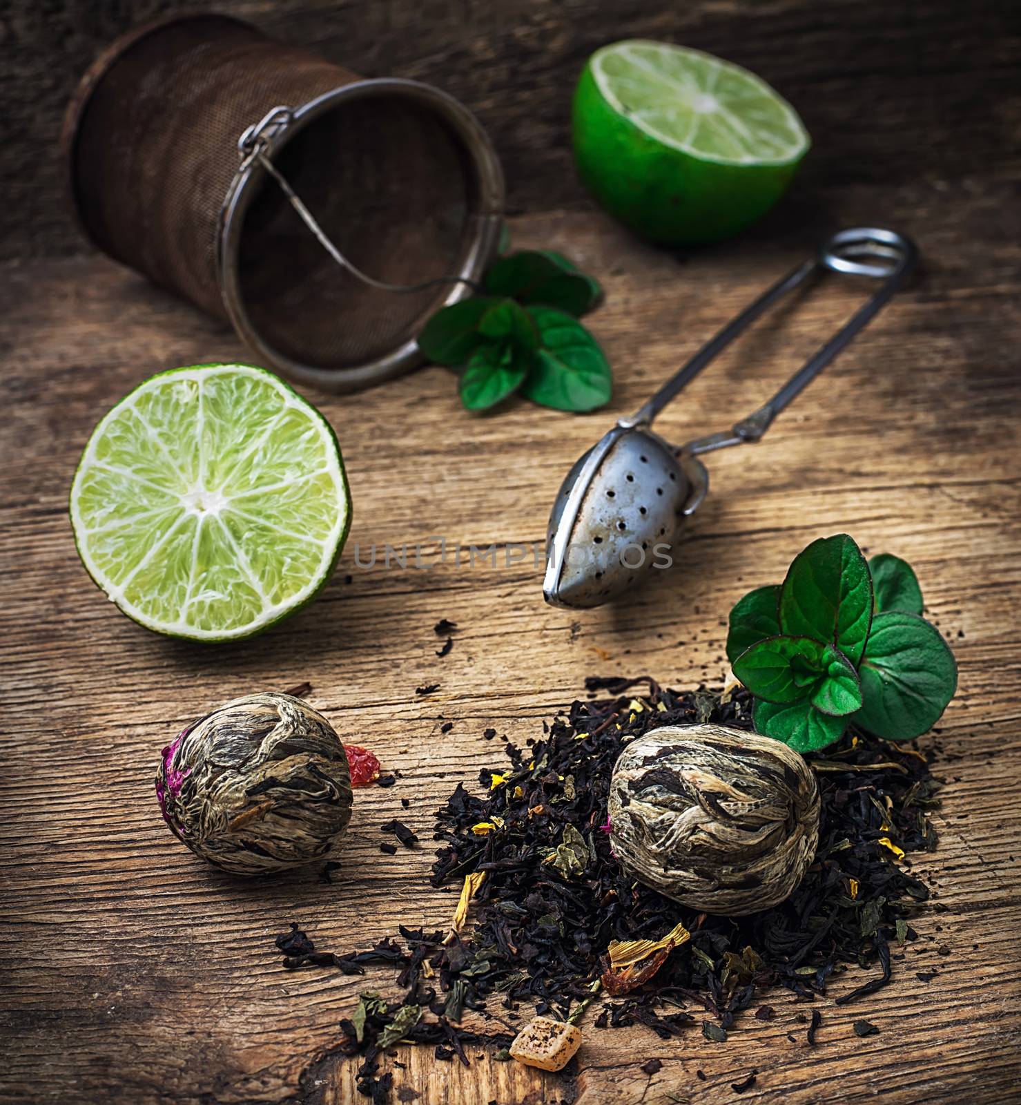  custard with spoon and spilled tea brewing and raspberry leaves on wooden background in country style.Selective focus