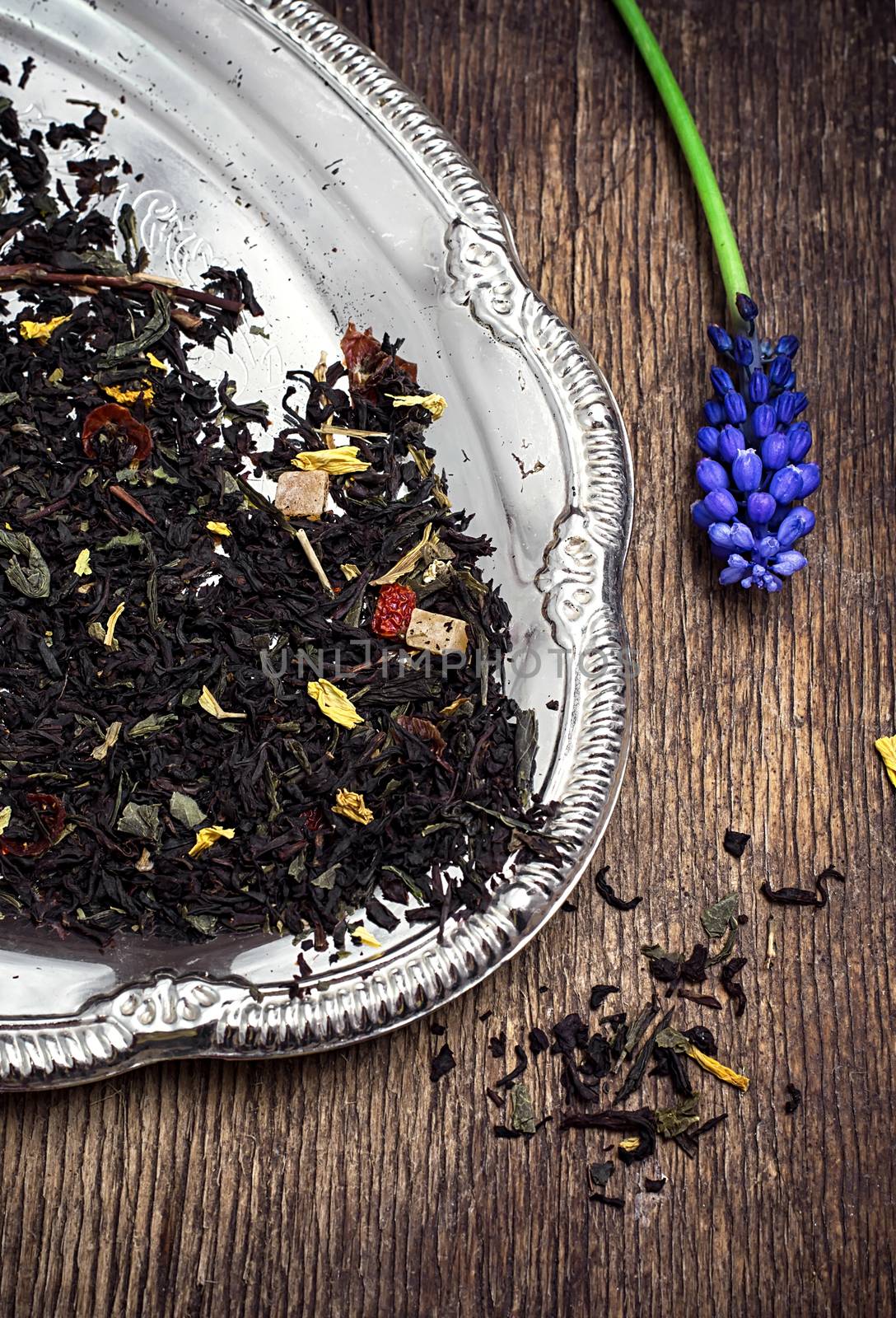 tea tea leaves scattered on the table in country style.Selective focus