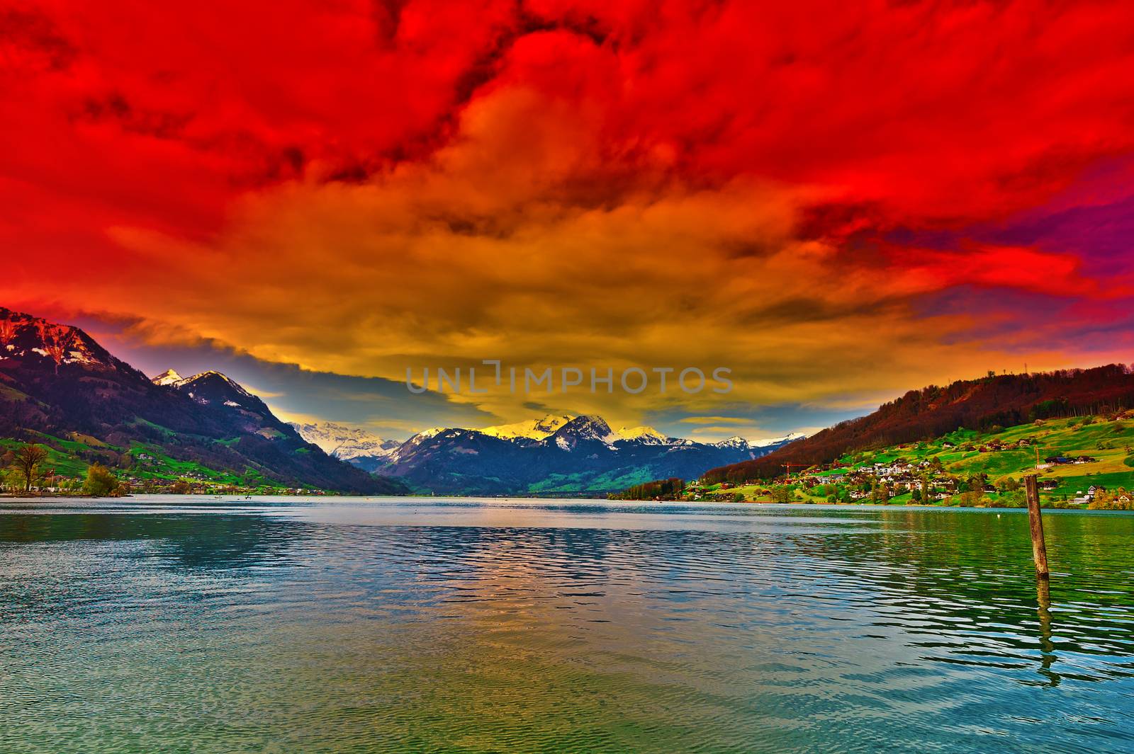 Lake Sarner on the Background of Snow-capped Alps in Switzerland at Sunset