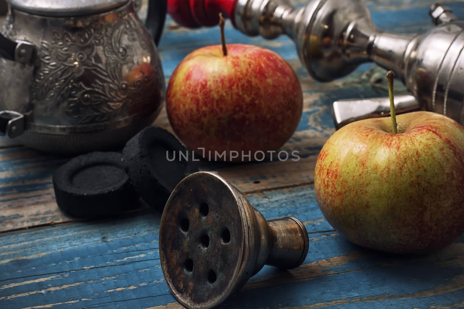 details smoking hookah on background of apples by LMykola