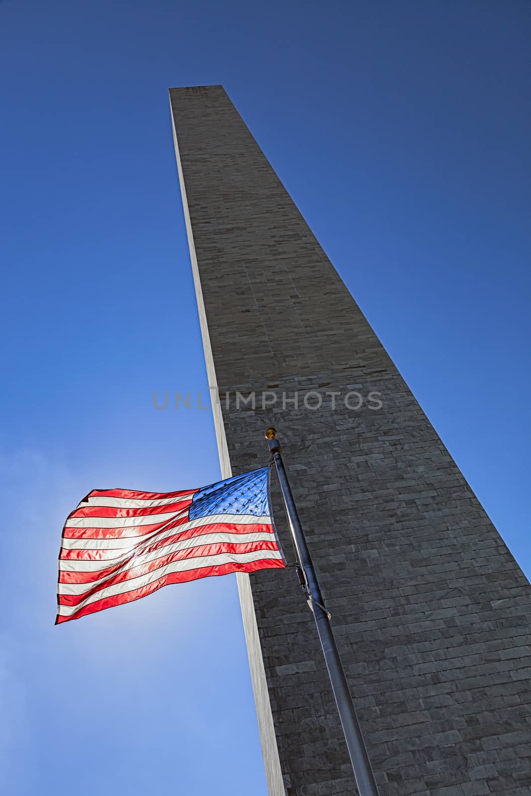 Washington Monument and US Flag by hanusst