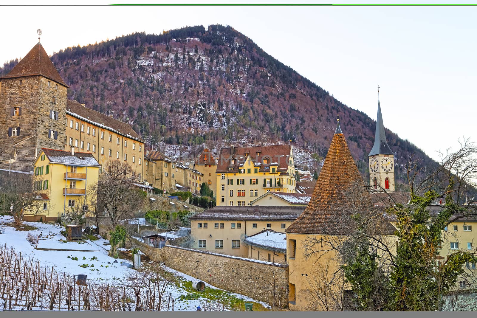 St Martin Church and vineyard of Chur in the morning. Chur is the capital of canton Graubunden in Switzerland. It lies in the Alpine Grisonian Rhine valley. The city is the oldest town of Switzerland