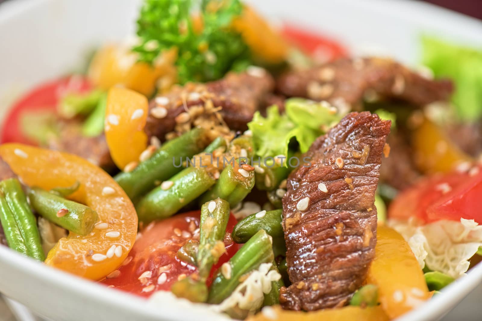 Warm salad with veal closeup