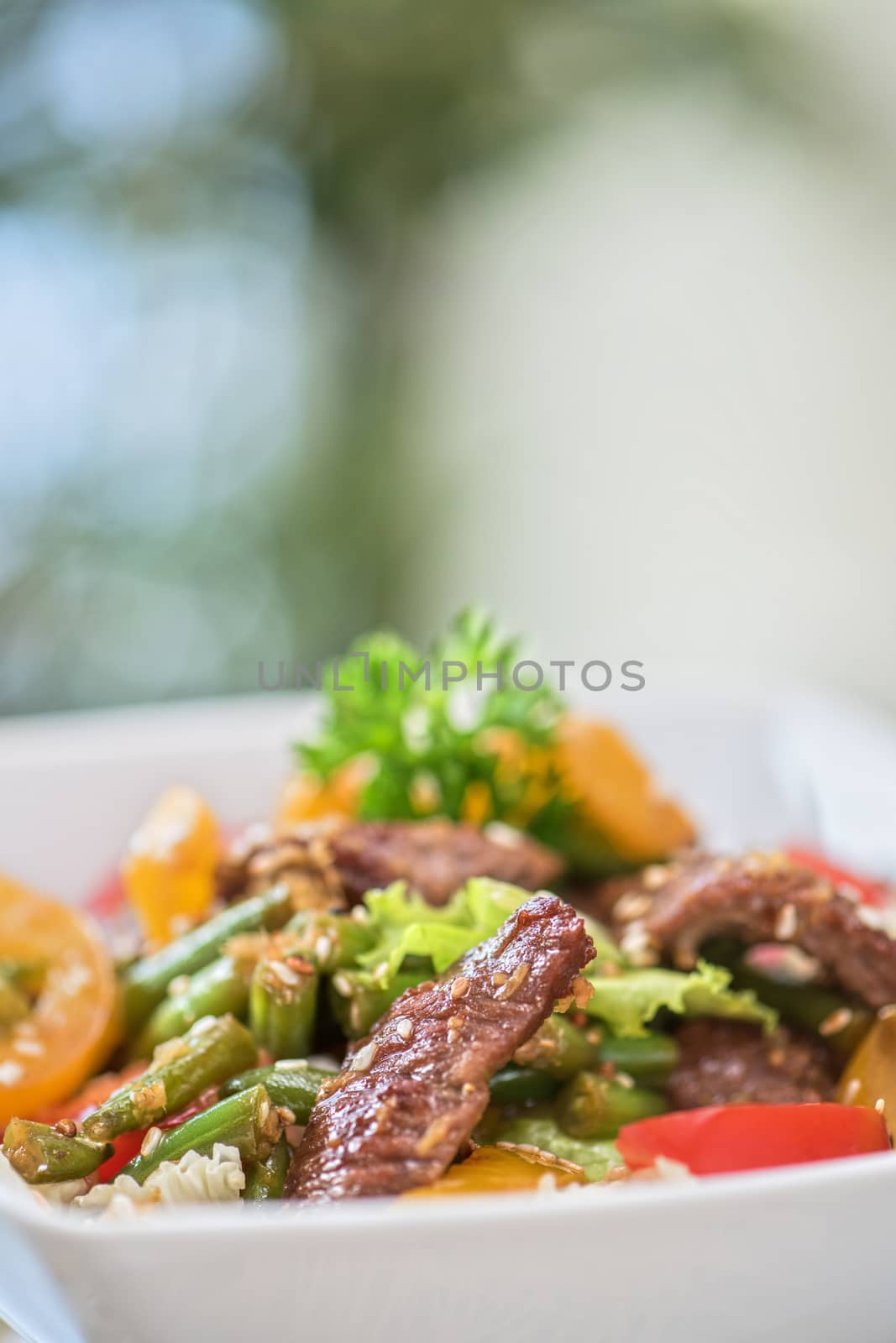 Warm salad with veal closeup