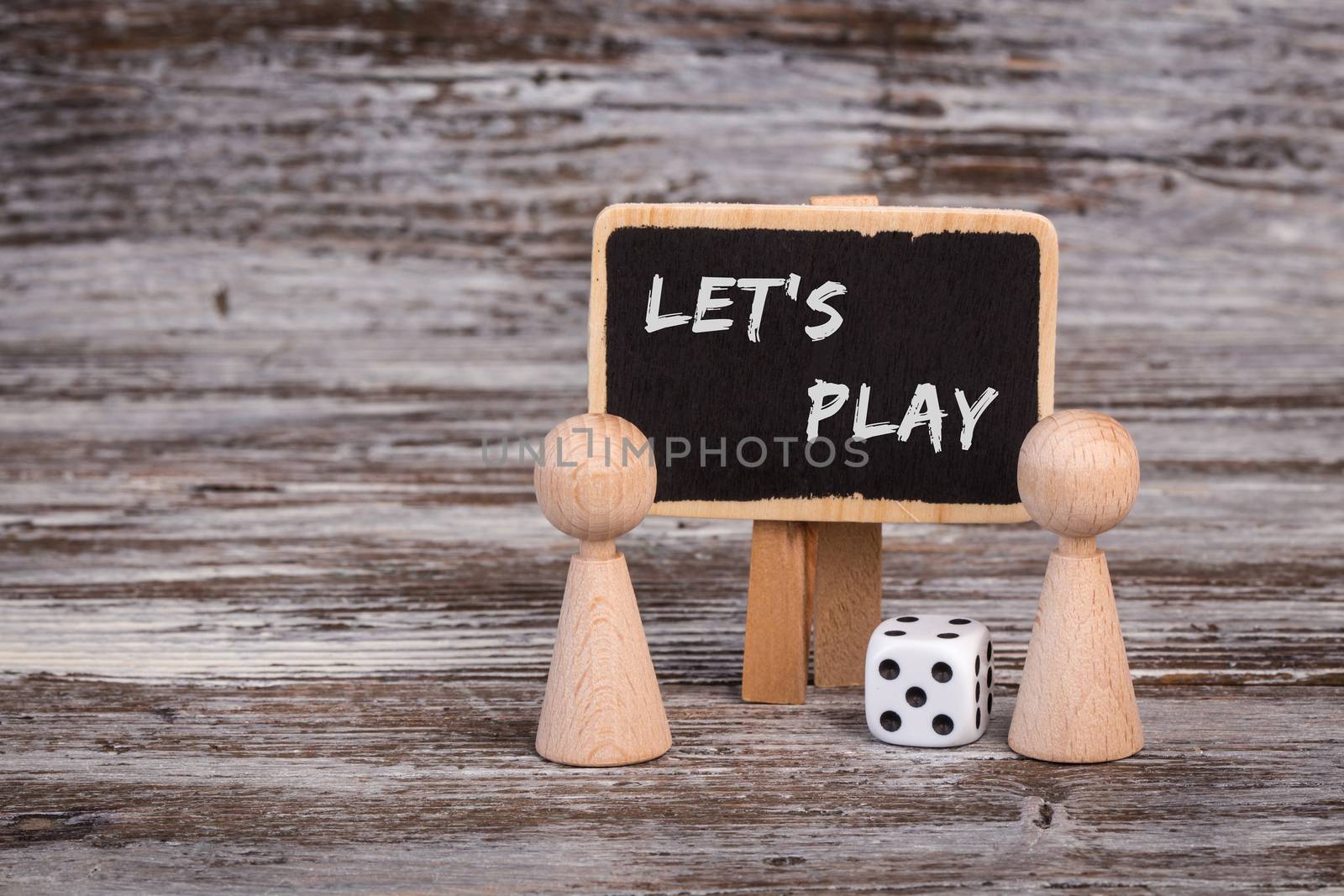 Play figures with dice and black board
