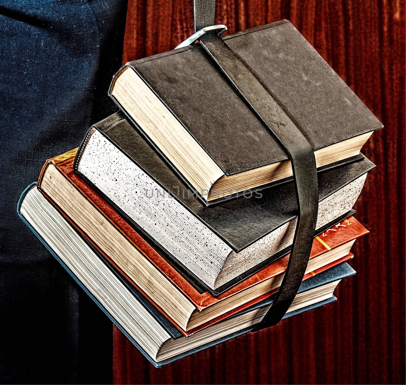 Five books hanging on a belt by JRTBurr