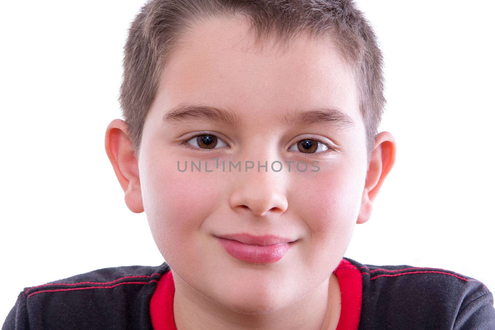 Young Boy in Black and Red Shirt Smiling at Camera by coskun