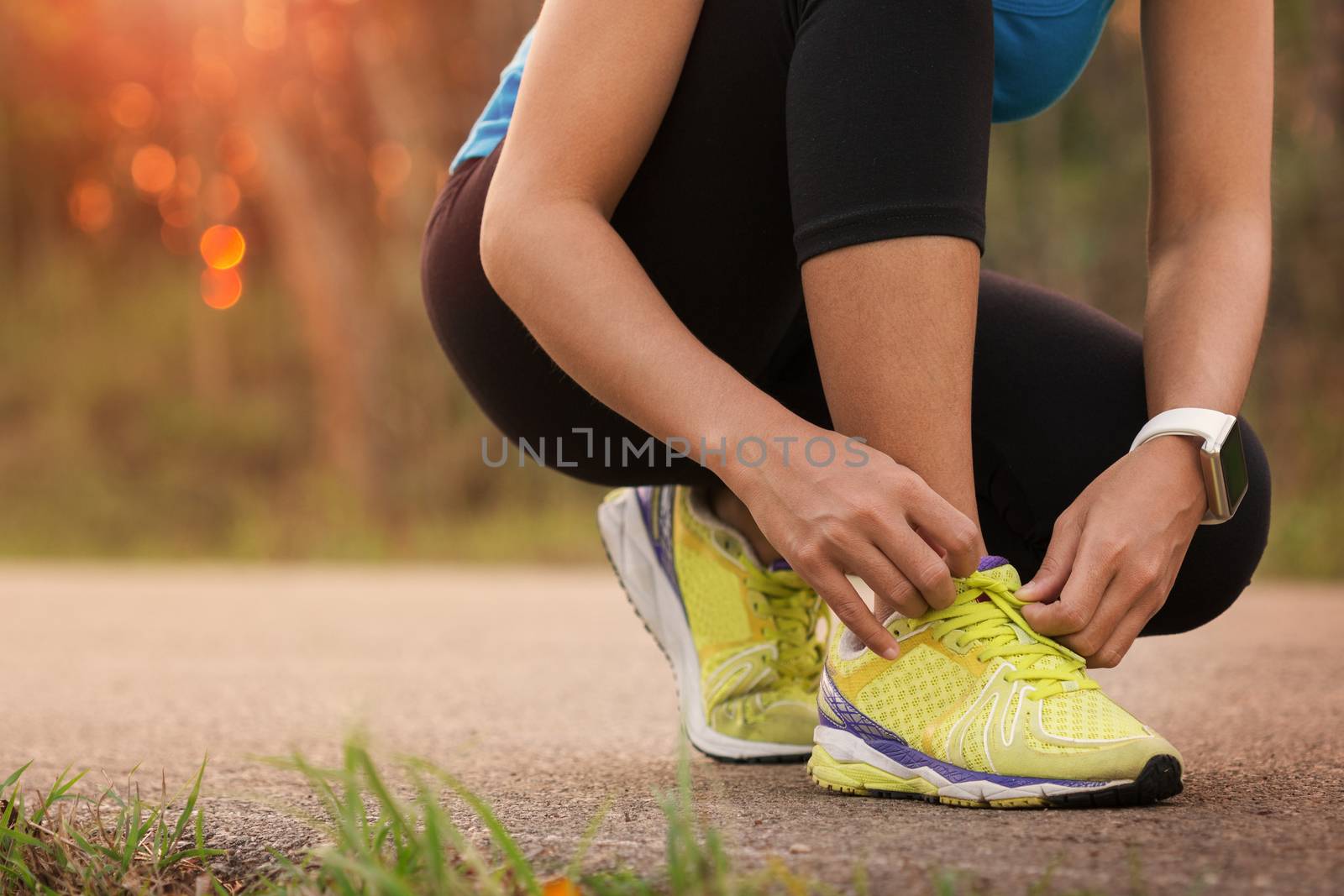 woman tying sport shoes ready for run