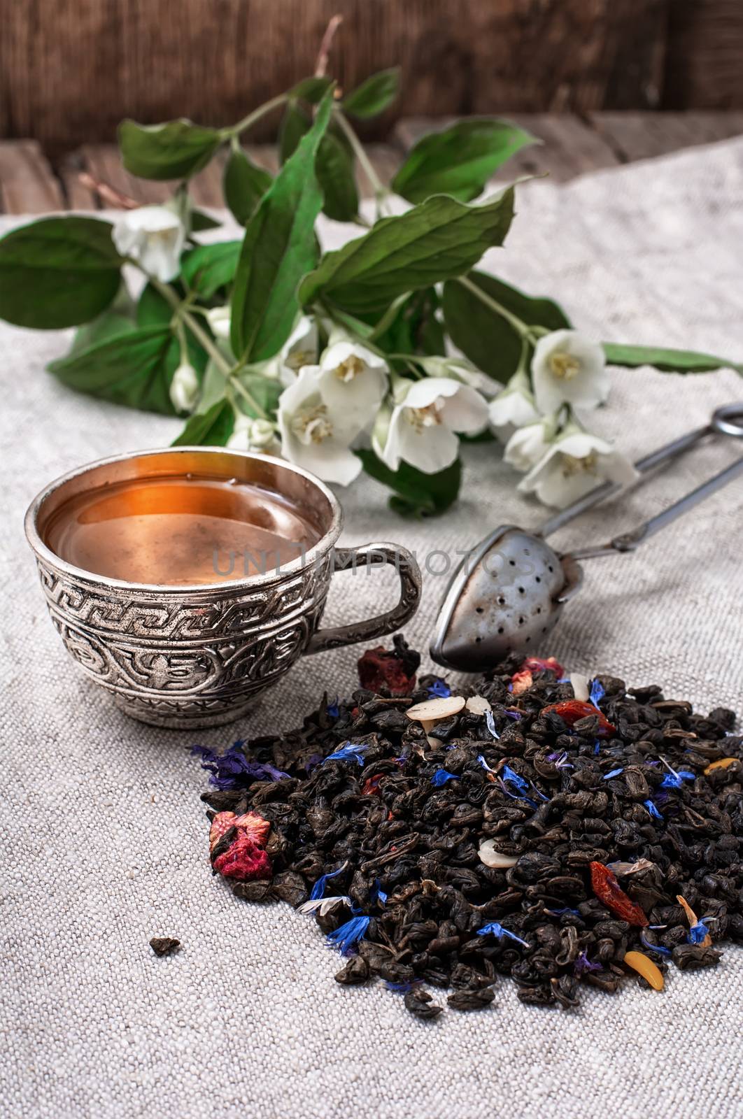 still life with old cups of brewed herbal tea and scattered welding