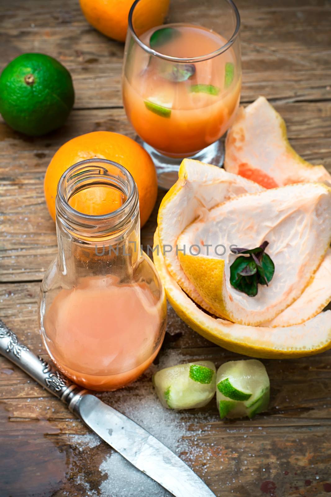 orange tangerine juice on the background of the rind in the rural style