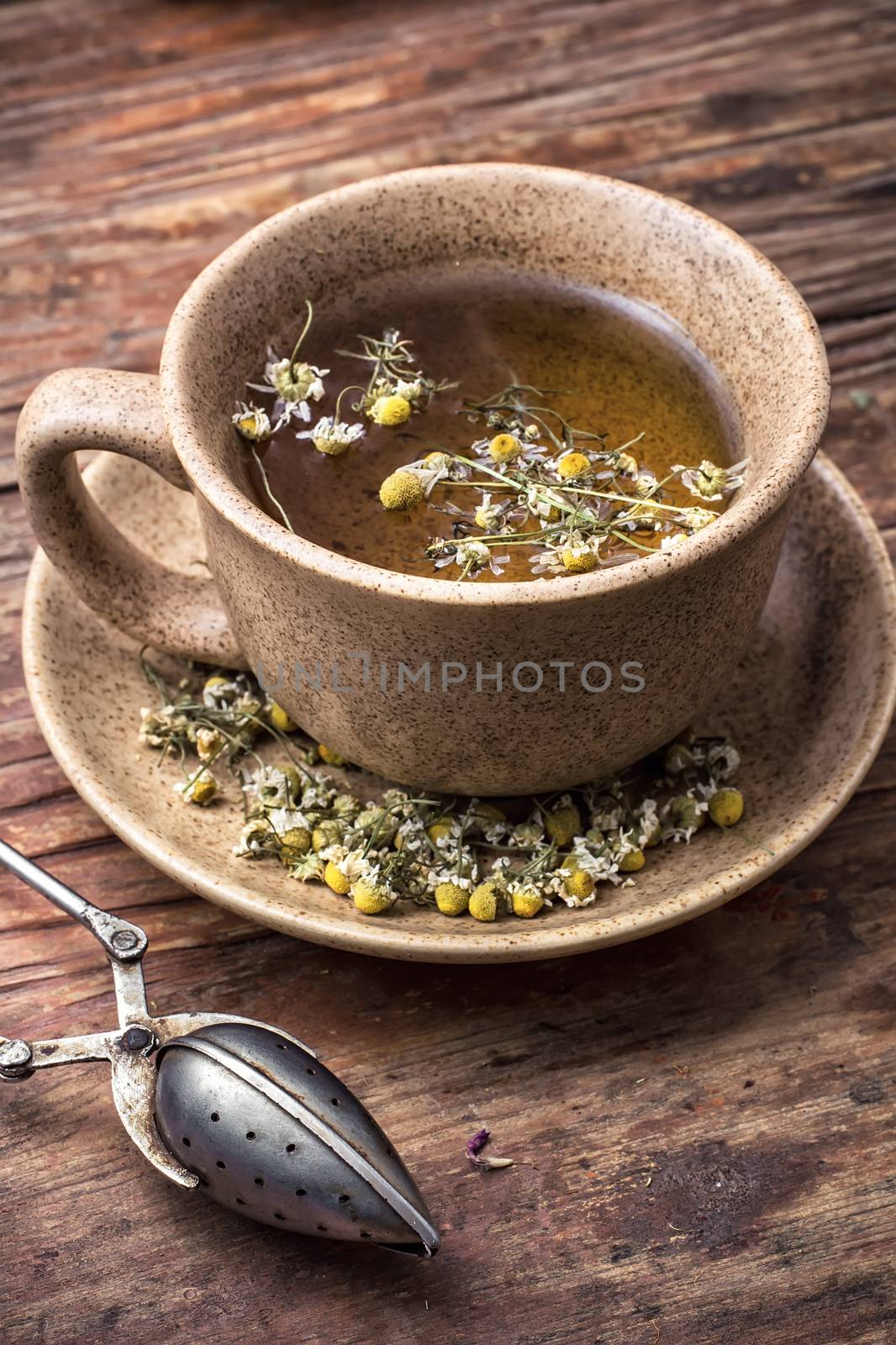 fragrant chamomile tea in rustic style.Selective focus