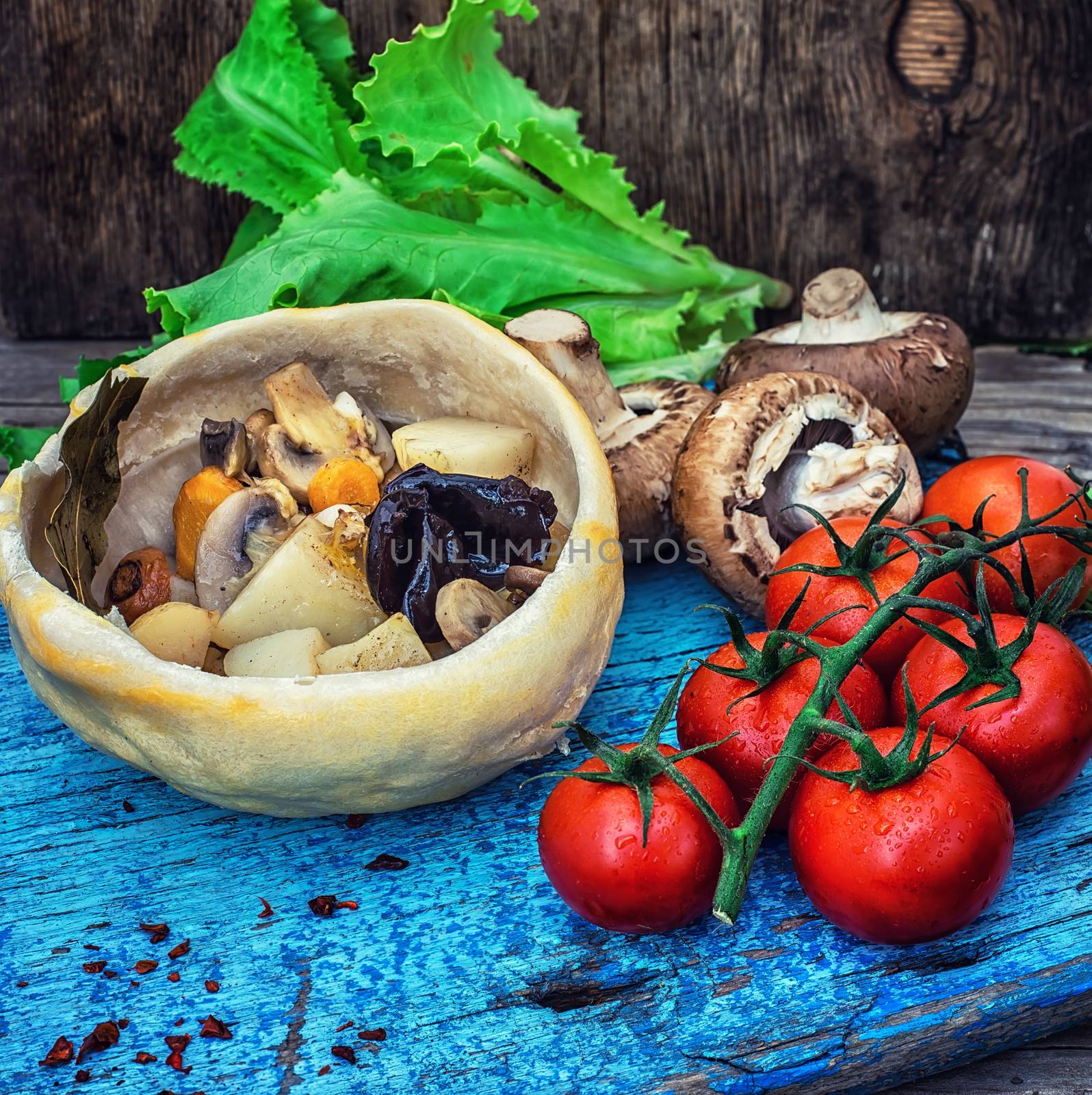 vegetable hot plate made of baked dough cooked in a rustic style.Photo tinted