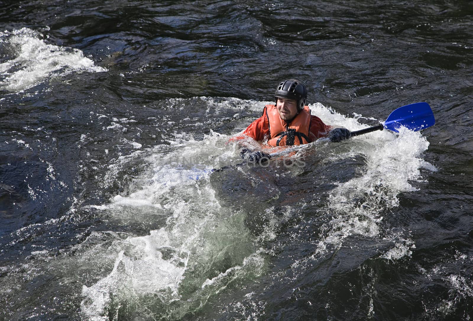 Kayaker in whitewater by Goodday