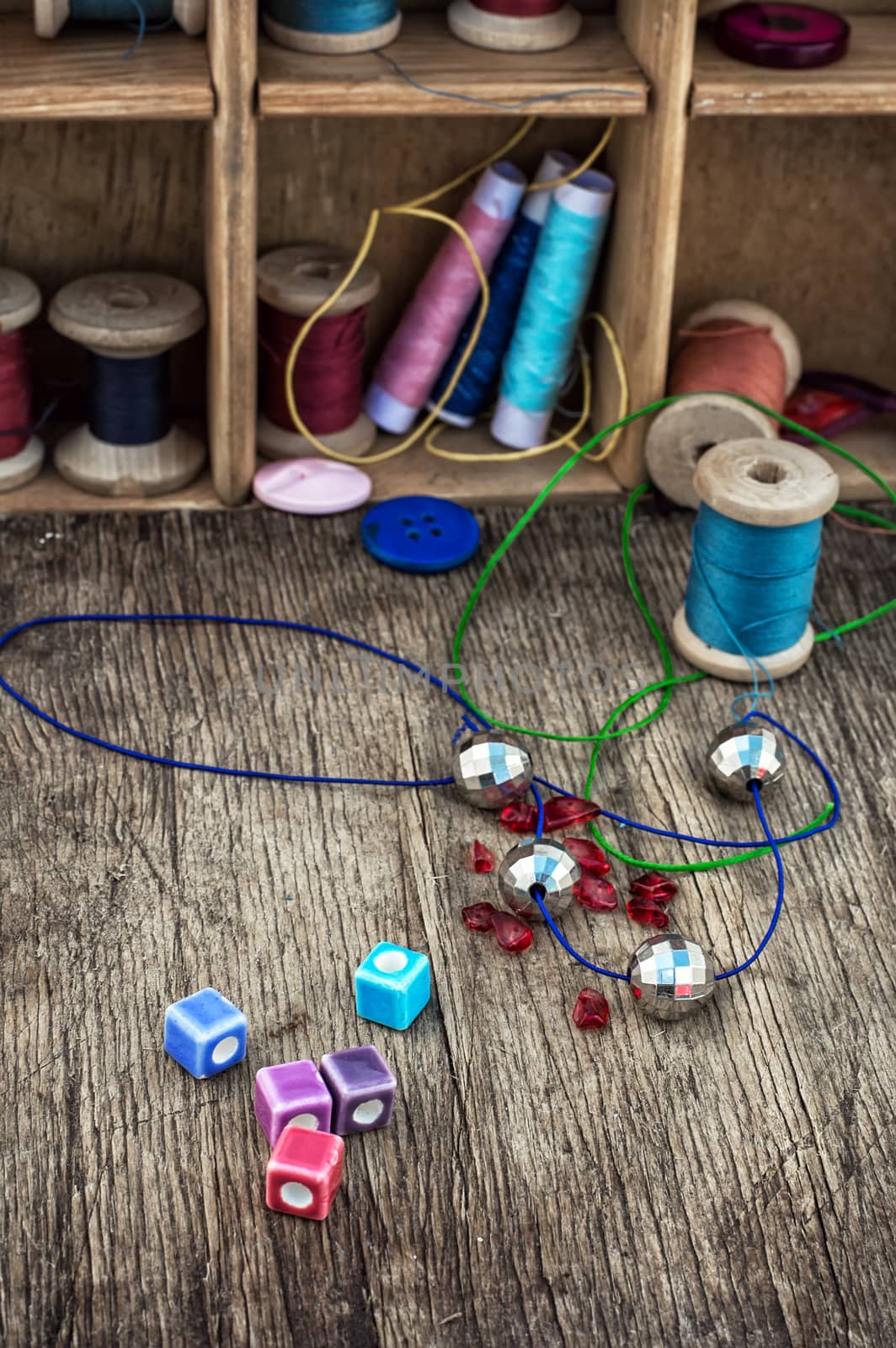 different tools for needlework beading and sewing in vintage style.Selective focus