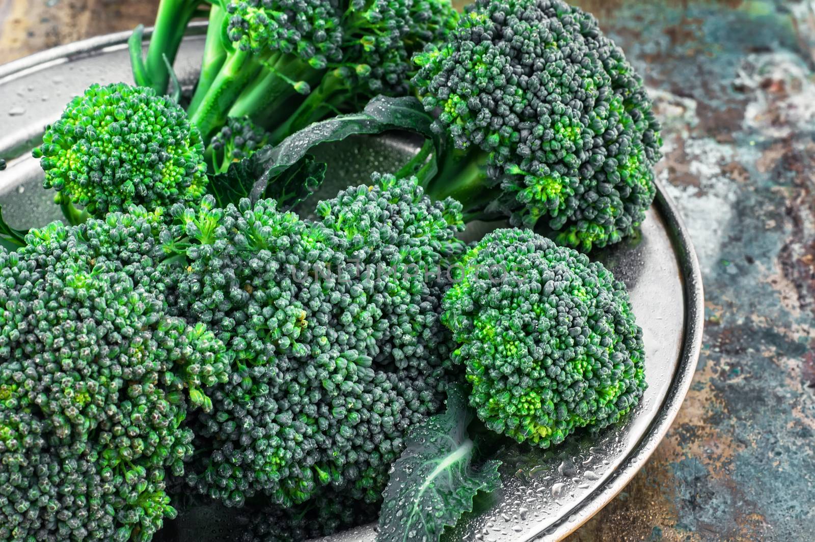 harvest broccoli cauliflower on an iron plate.The image is tinted.