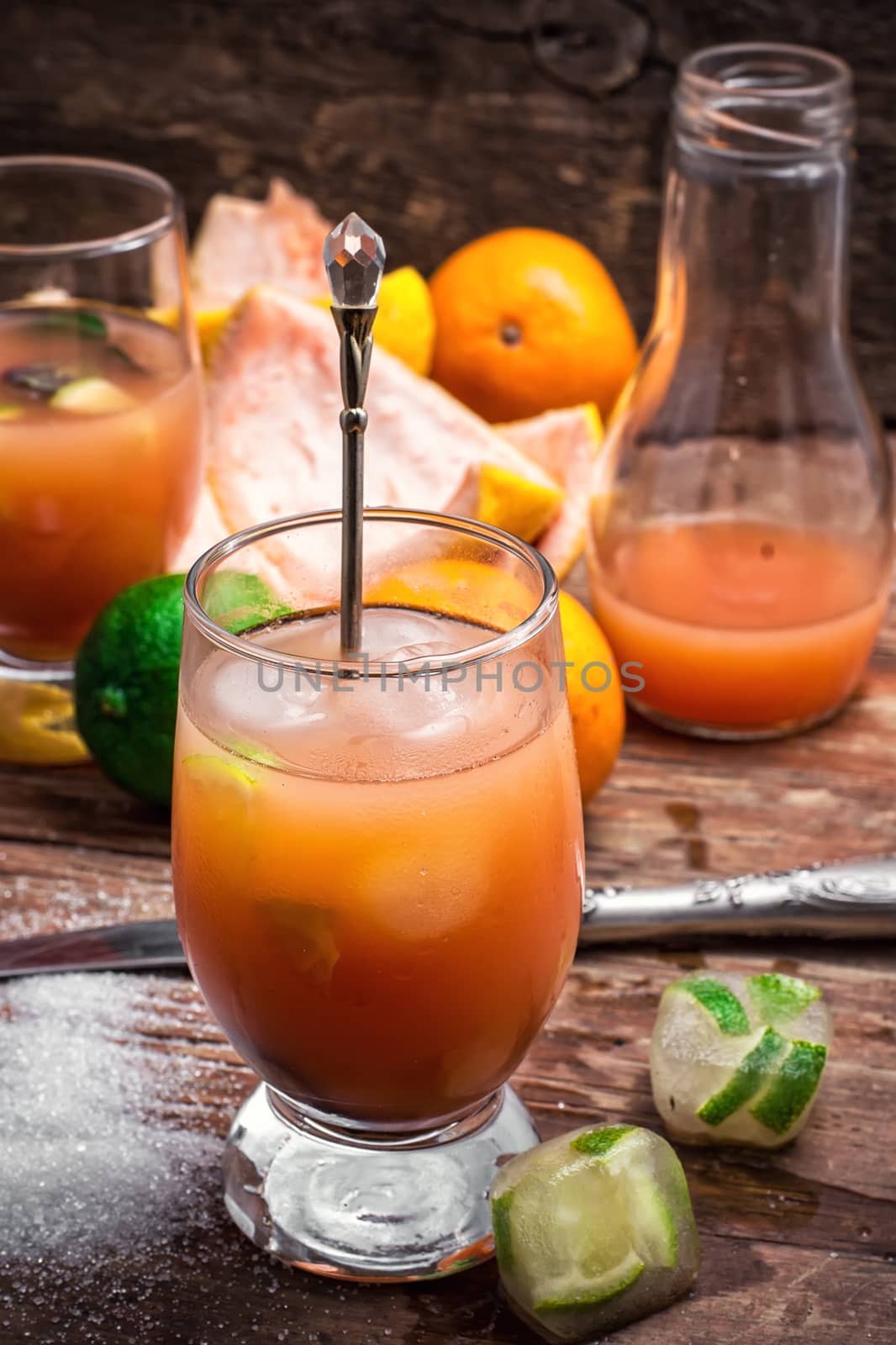 glass with drink of freshly squeezed tropical fruit with pulp.Selective focus.Photo tinted.