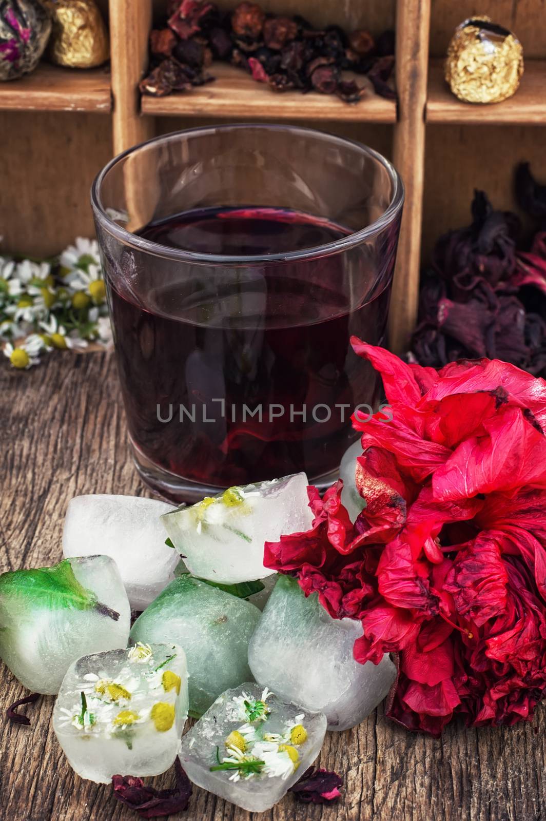 Hibiscus tea rose and welding on the background of the tea shelves in vintage style.Photo tinted.Selective focus