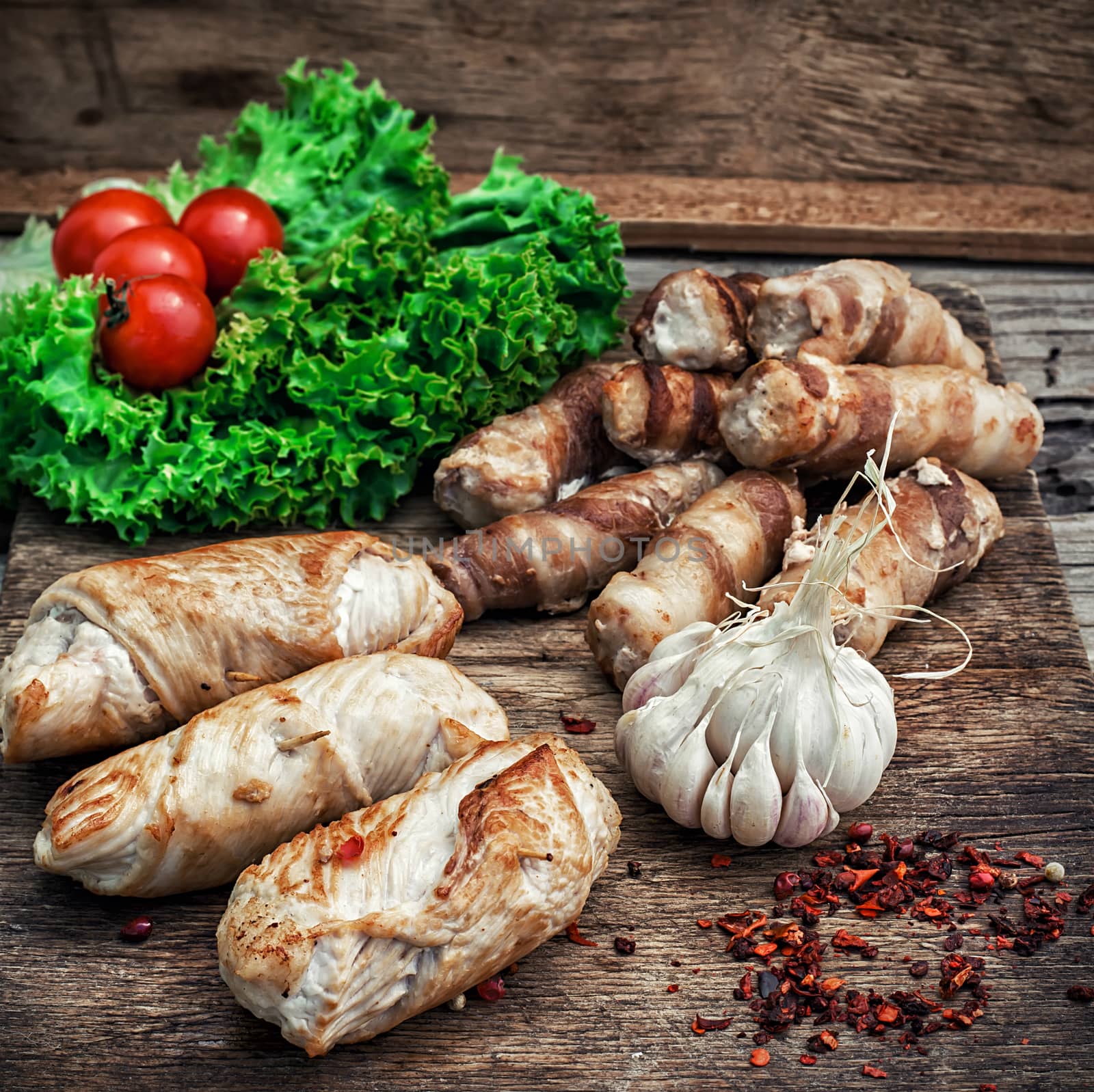 set fried meat sausages on wooden background by LMykola