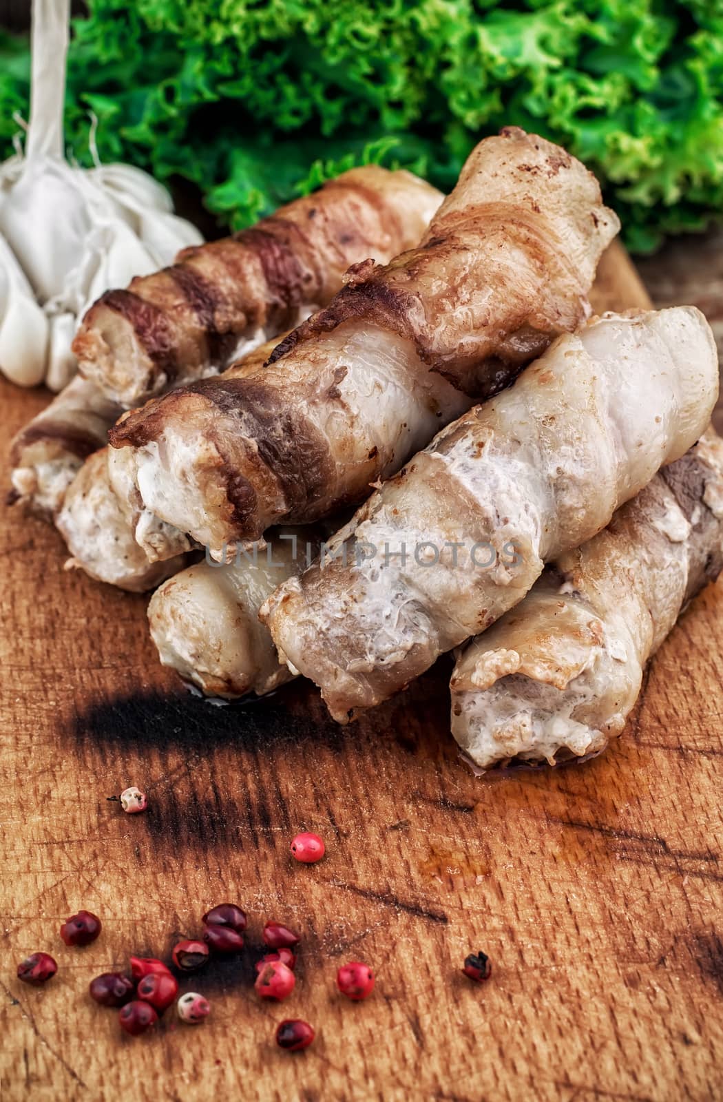 set fried meat sausages with salad on wooden background