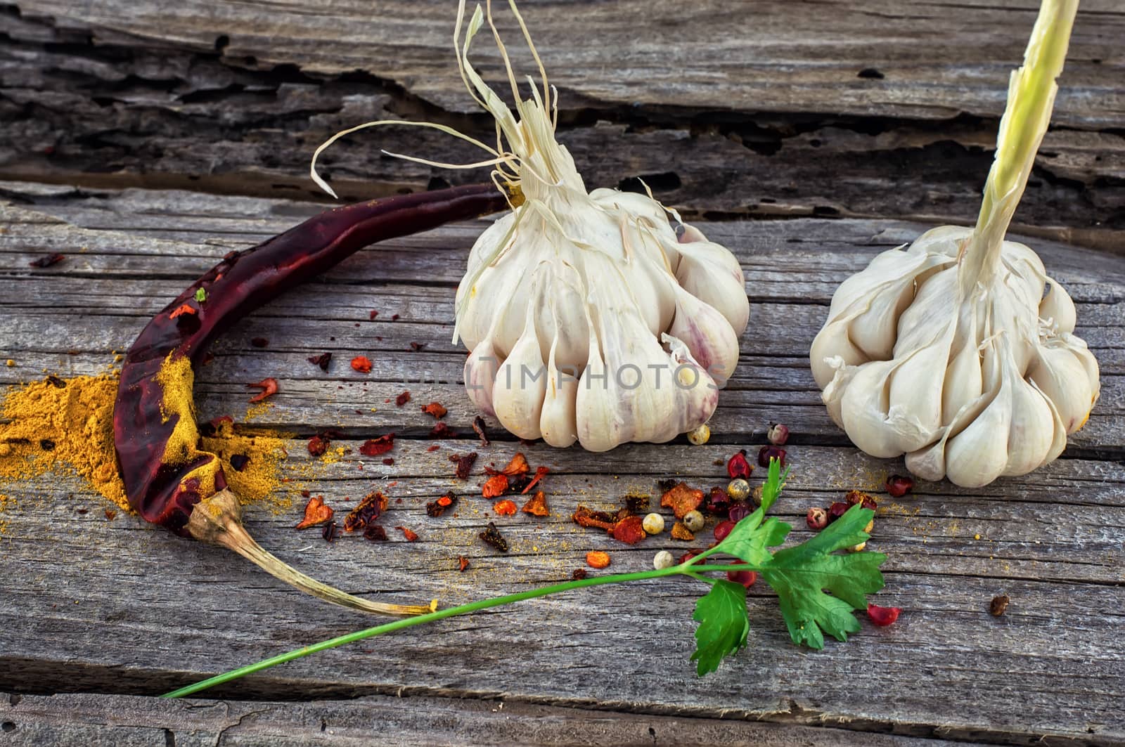 garlic,pepper and seasoning on wooden vintage background.Selective focus