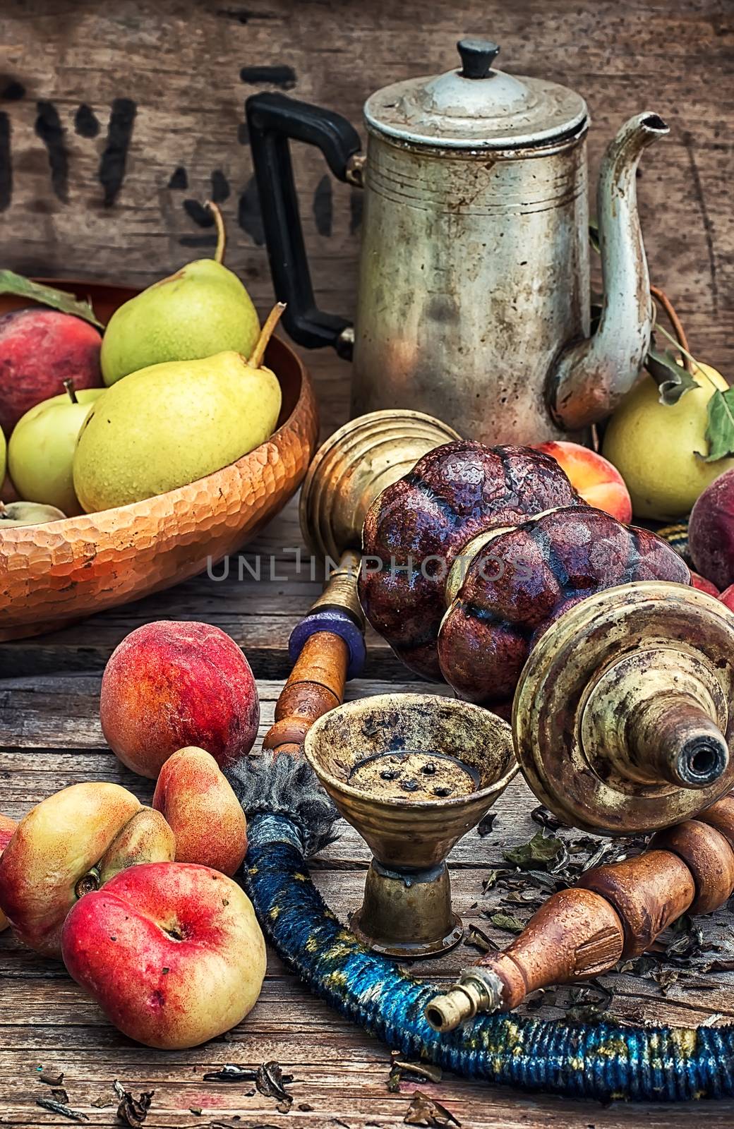Details were worked hookah on the table amid fresh peaches.Photo tinted.