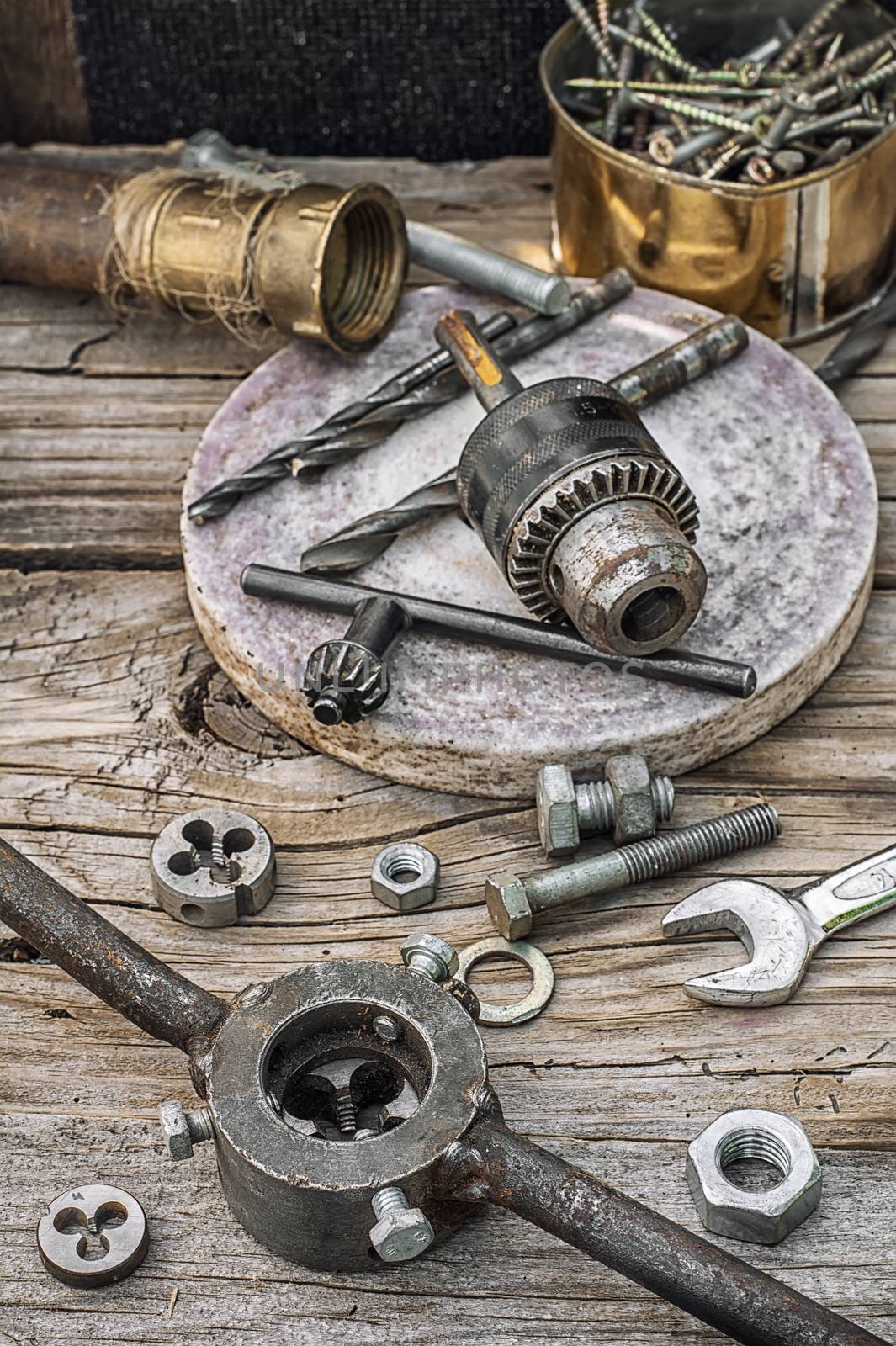 Set of old tools of the keys,screws and drills.