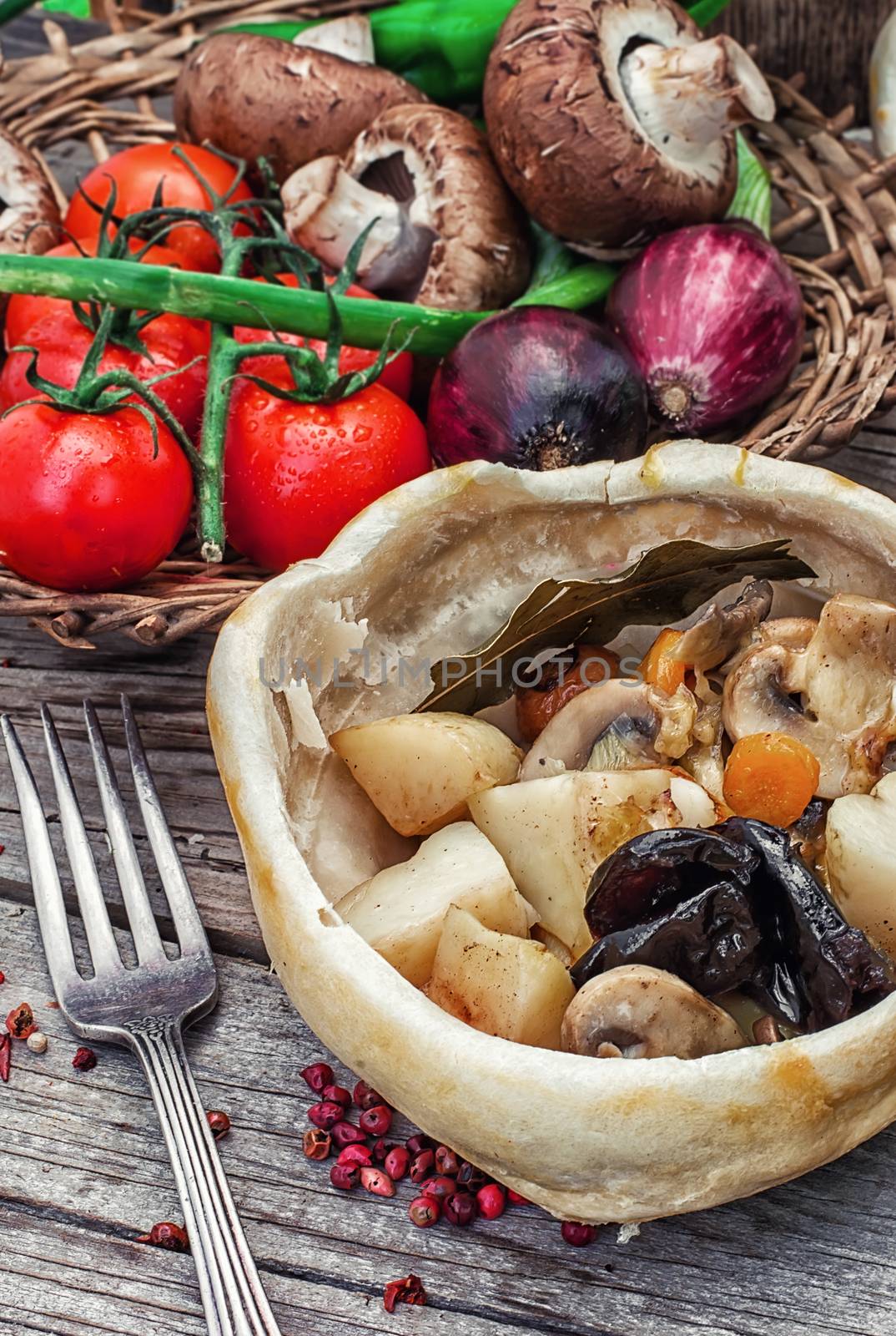 vegetable hot plate made of baked dough cooked in a rustic style.Photo tinted.Selective focus