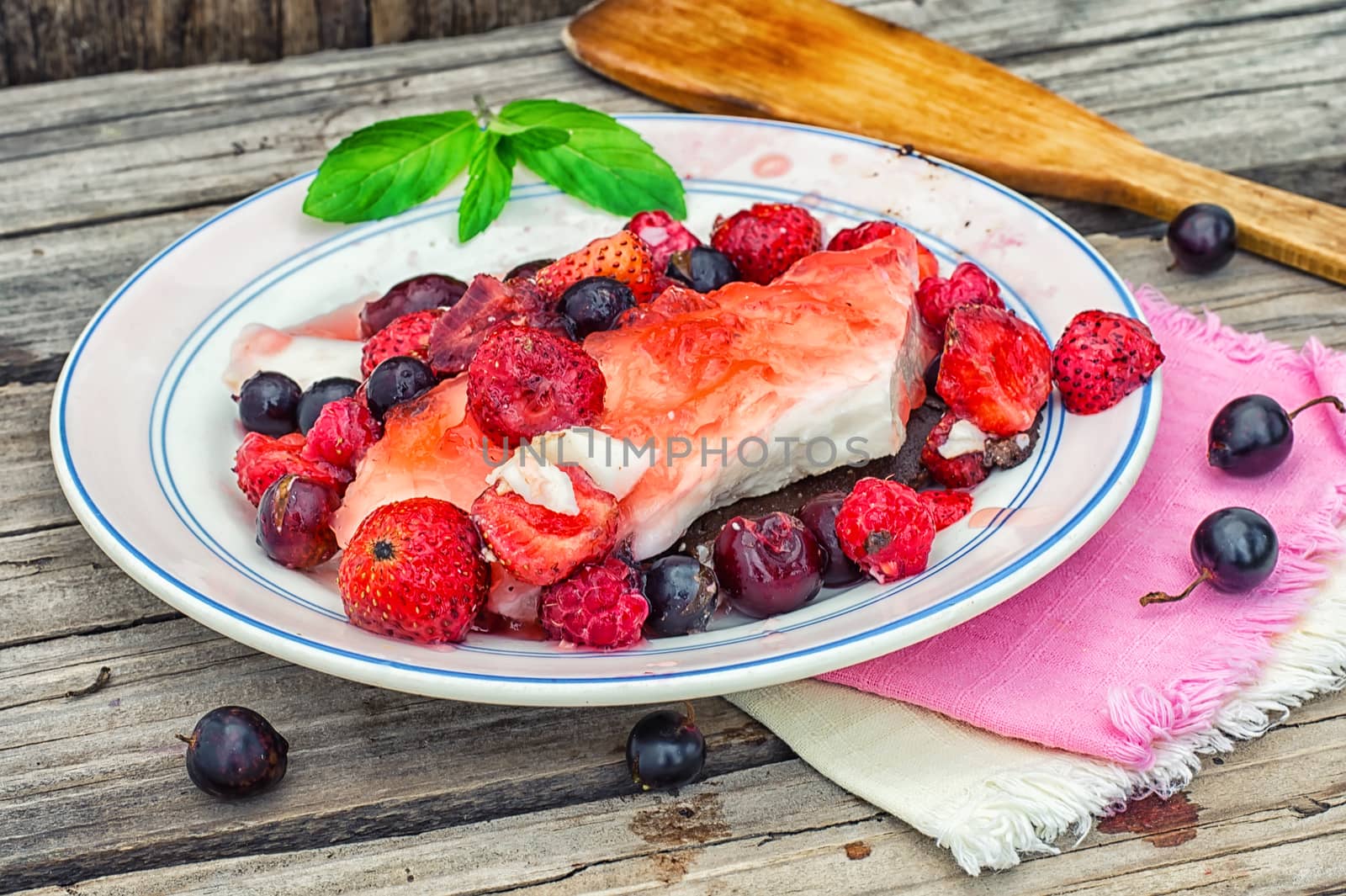 curd jelly cake with strawberries,raspberries and black currants.