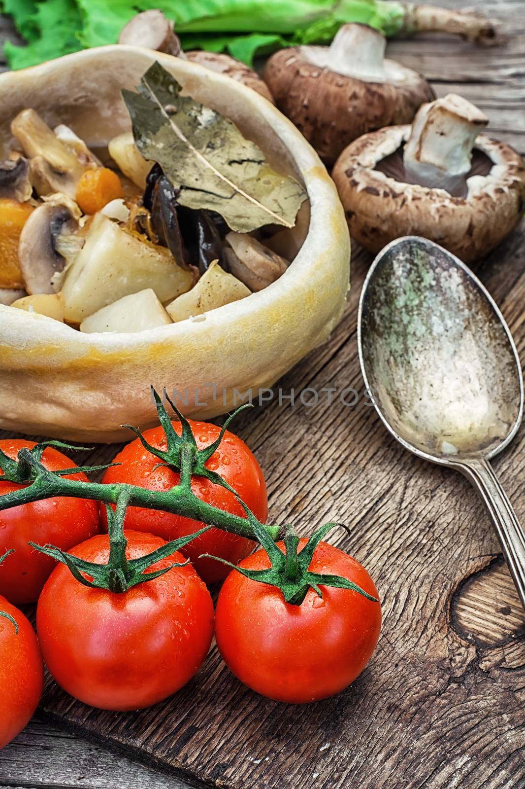 vegetable hot plate made of baked dough cooked in  rustic style.Photo tinted.Selective focus