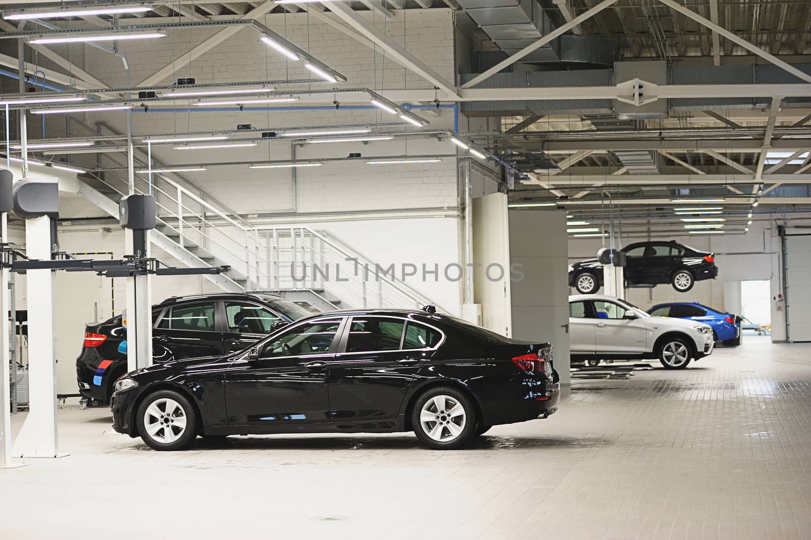 Car parked for repair in big and clean garage