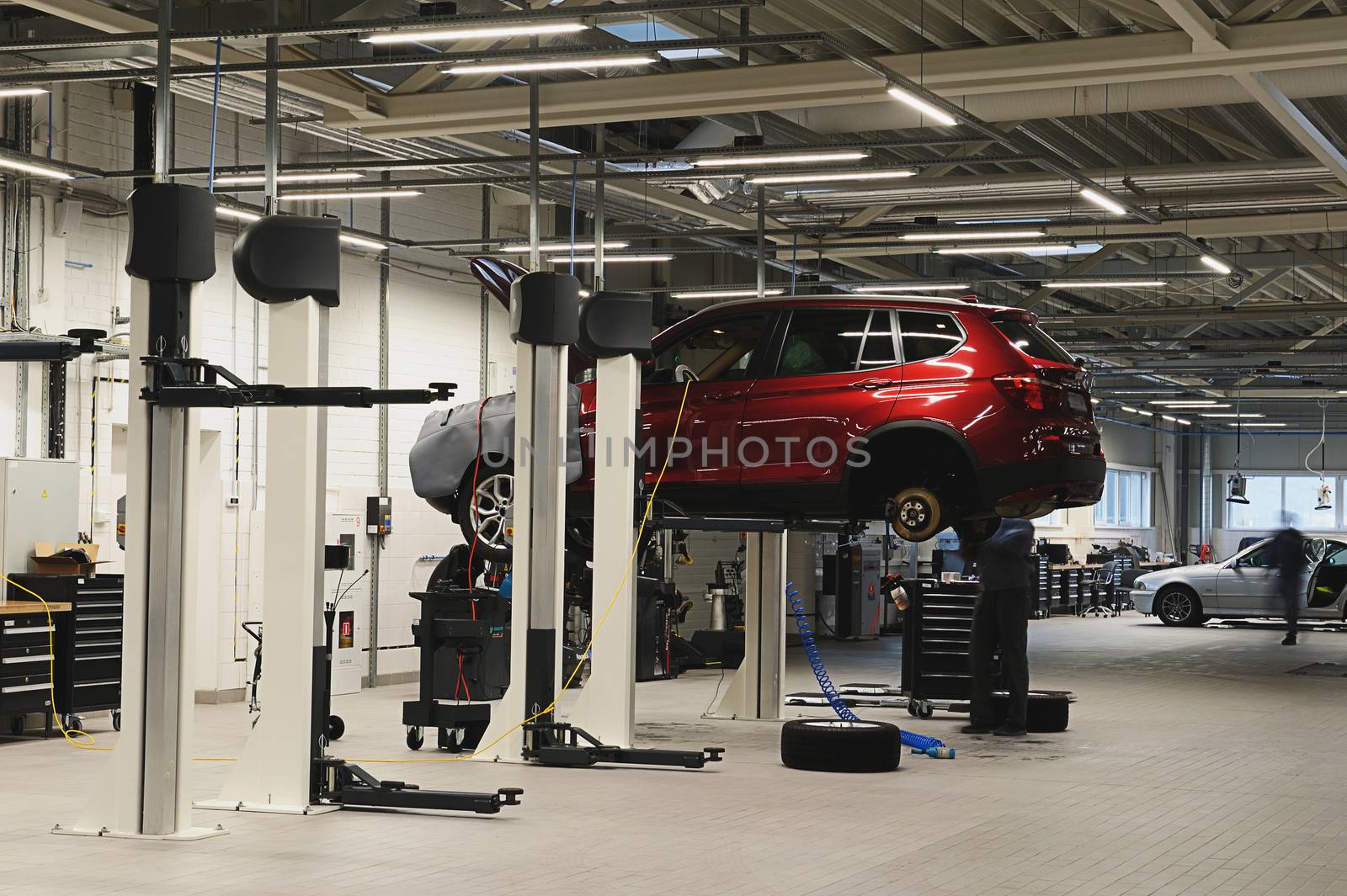 Car hanging in light and modern garage