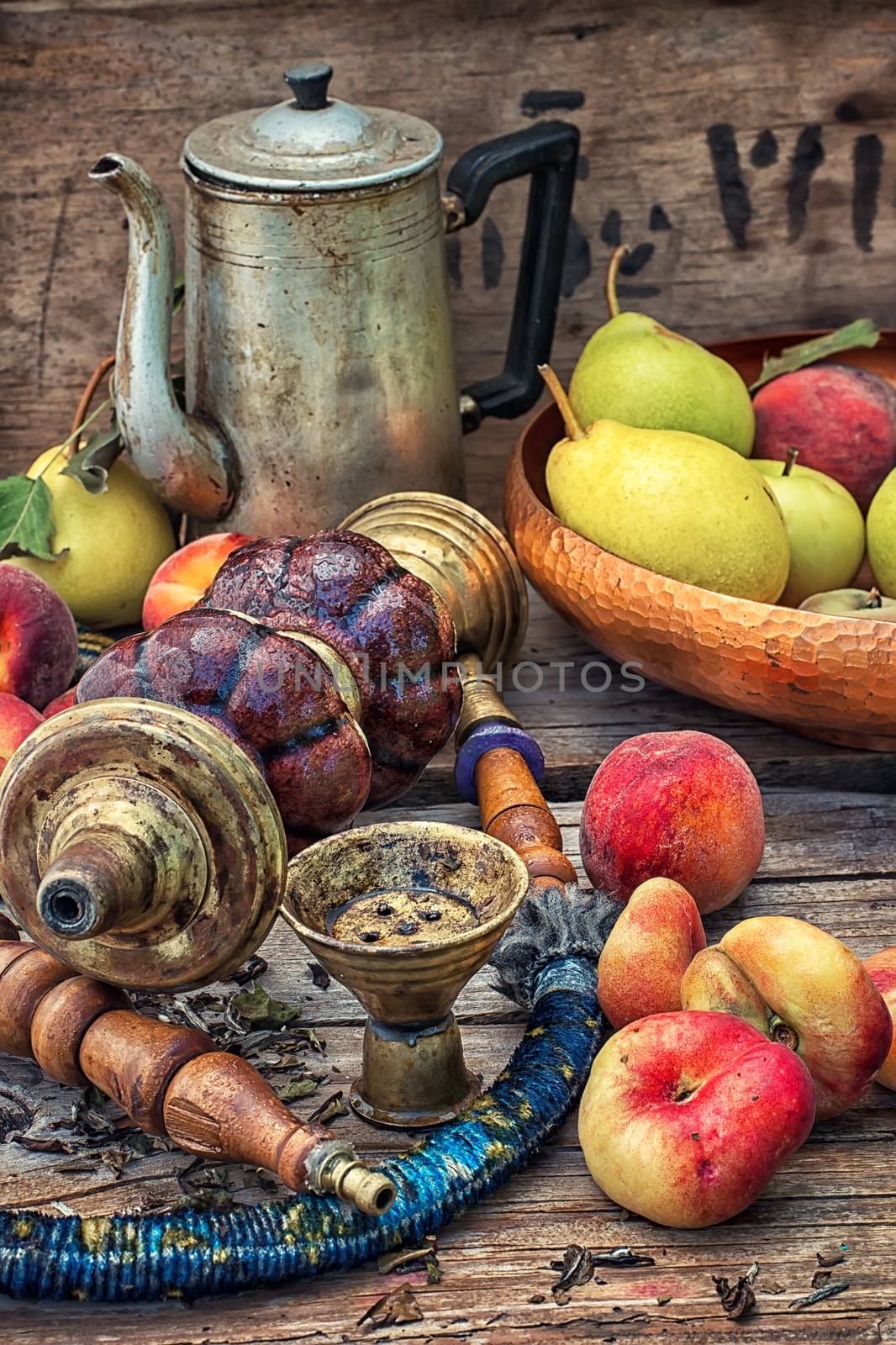 Details were worked hookah on the table amid fresh peaches.Photo tinted.Selective focus