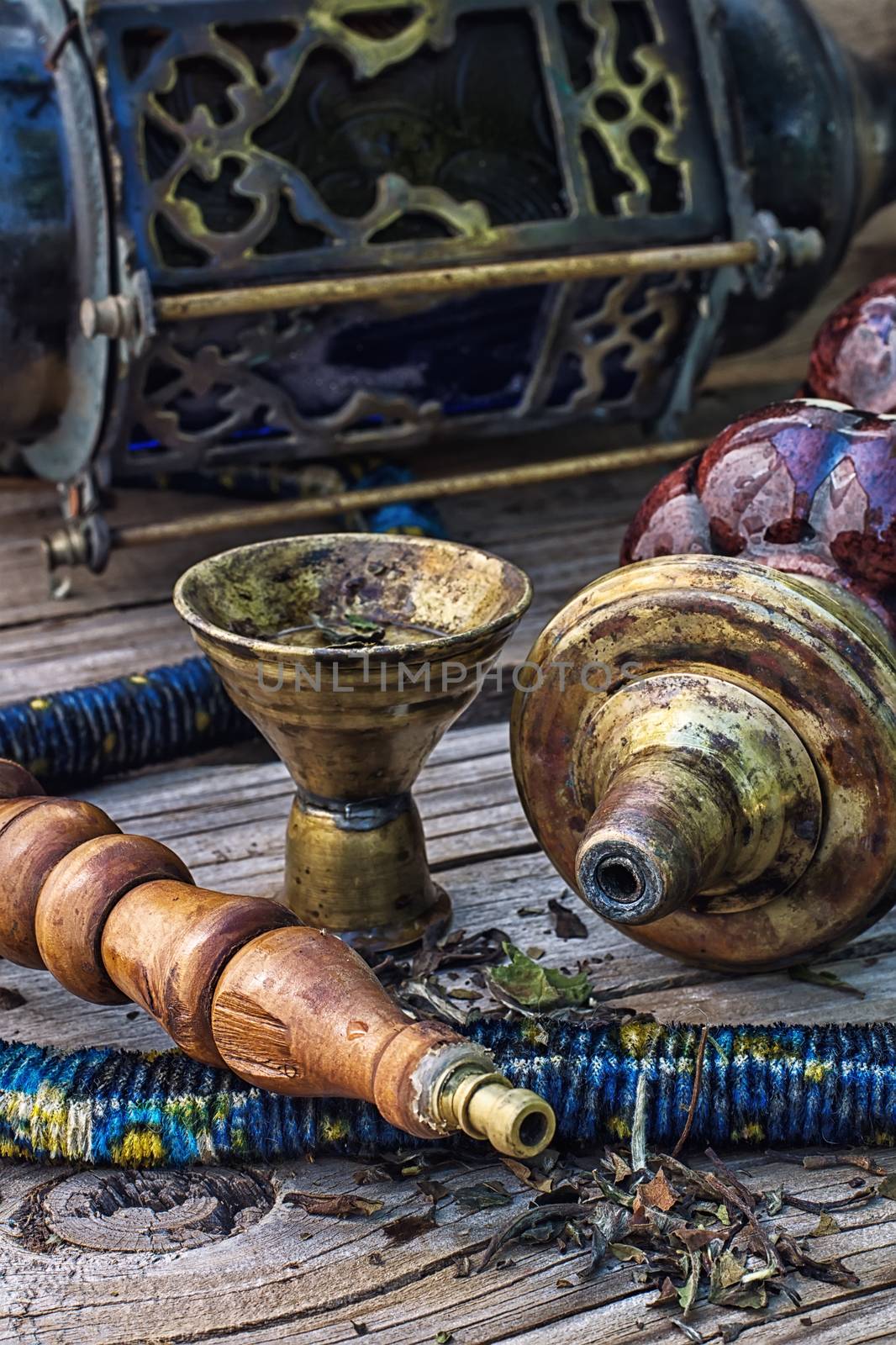 Details were worked hookah on the table .Photo tinted.Selective focus