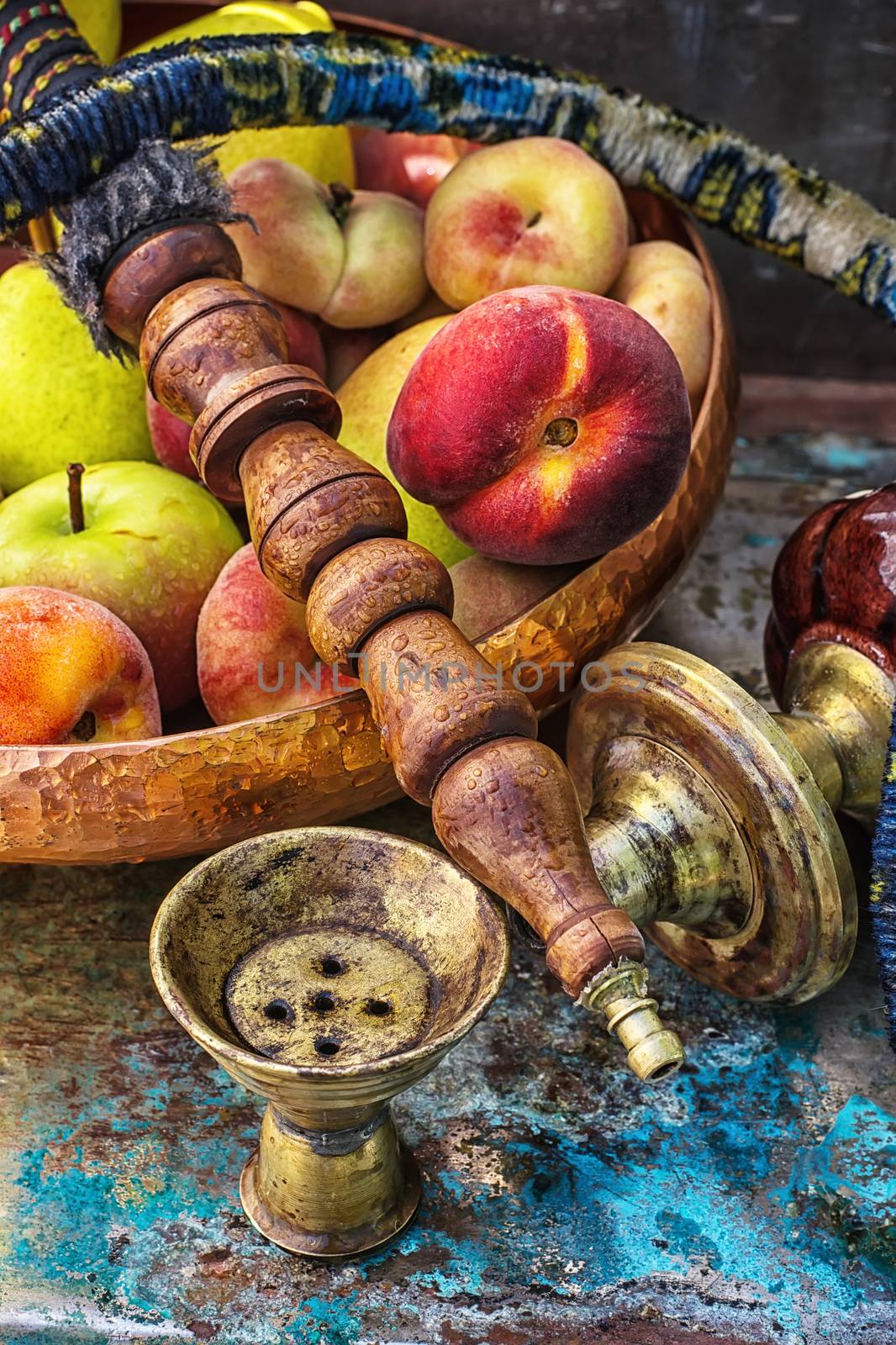 Details were worked hookah on the table amid fresh peaches.Photo tinted.