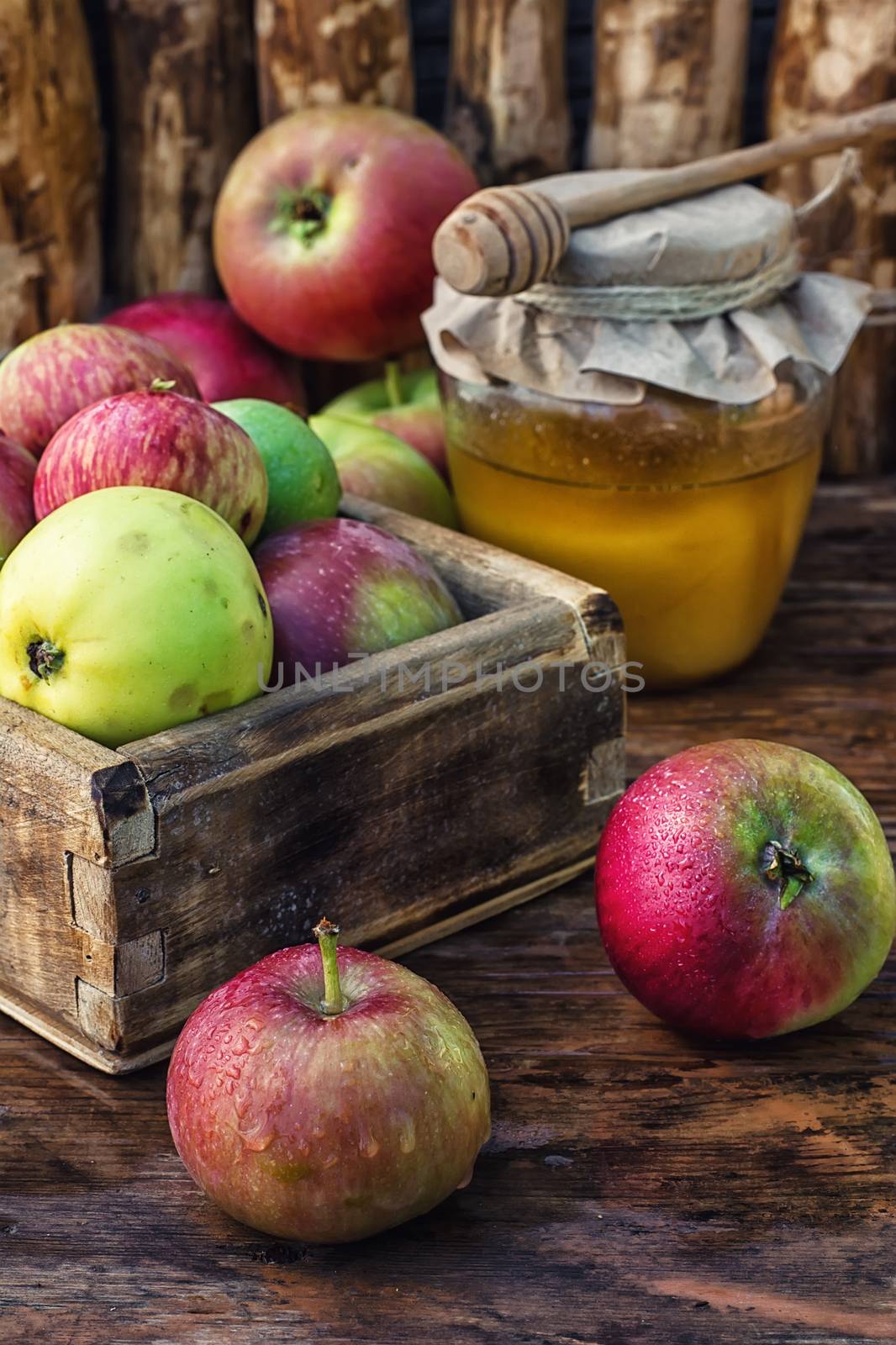 wooden box with the harvest of apples and honey for the holiday apple spas.Photo tinted.