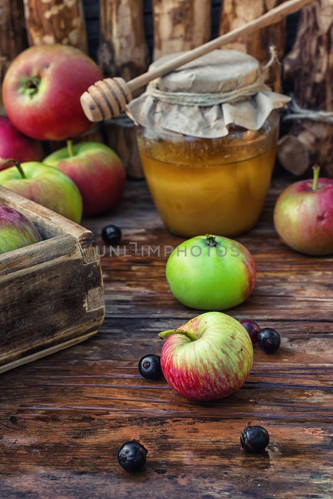 Still life from the harvest of ripe apples and honey to the Church celebration of the apple feast day.Photo tinted.