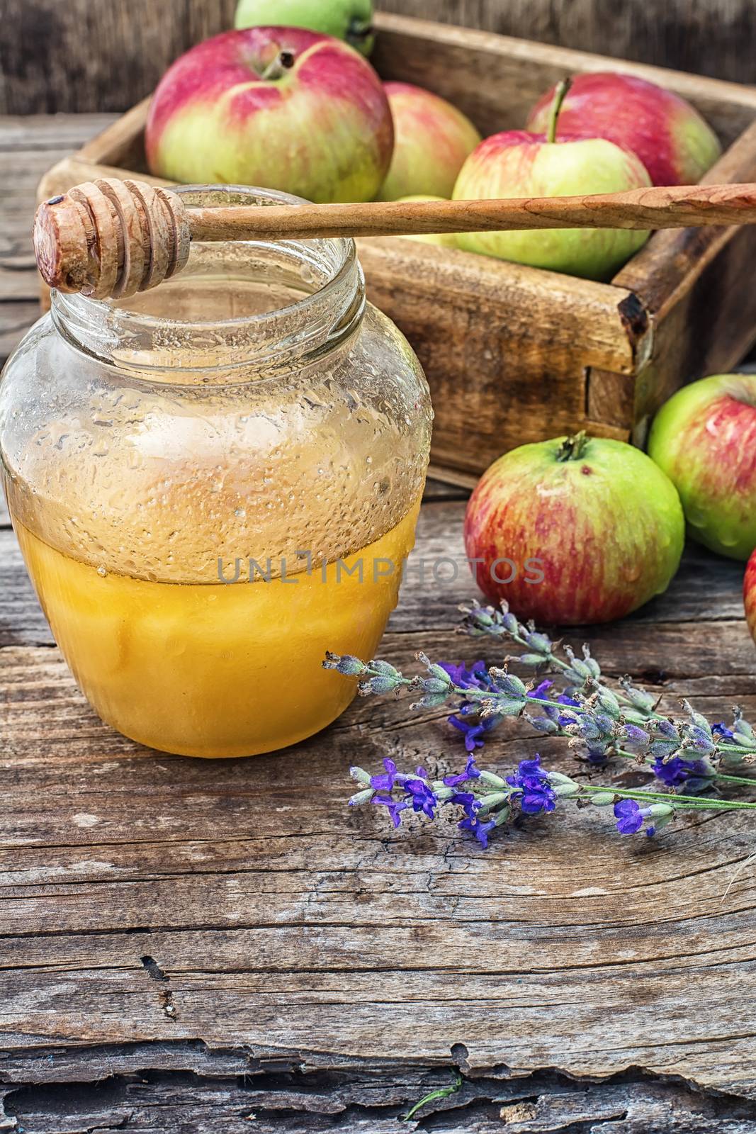 Still life from the harvest of ripe apples and honey to the Church celebration of the apple feast day.Photo tinted.