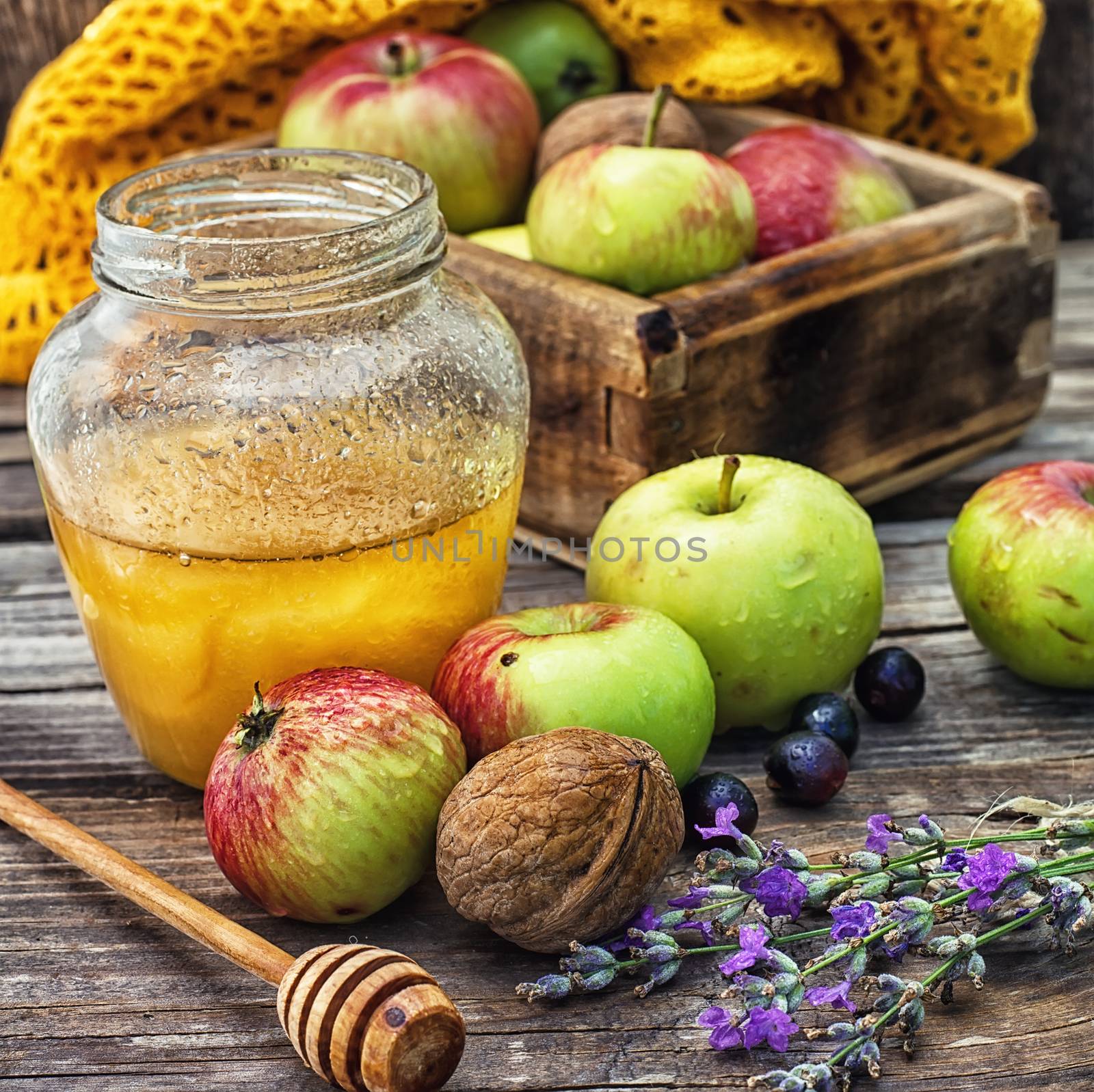 Still life from the harvest of ripe apples and honey to the Church celebration of the apple feast day.Photo tinted.