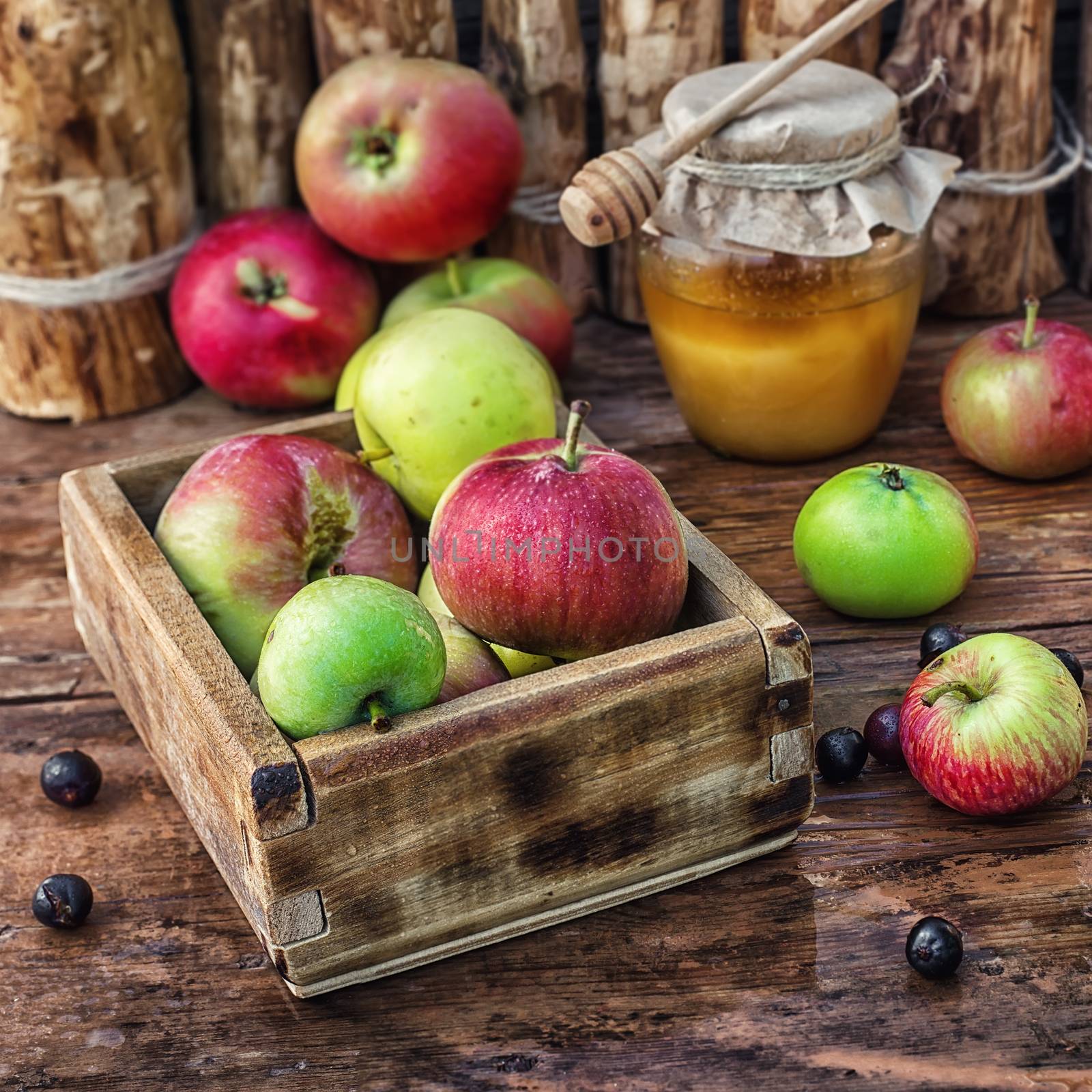 Still life from the harvest of ripe apples and honey to the Church celebration of the apple feast day.Photo tinted.