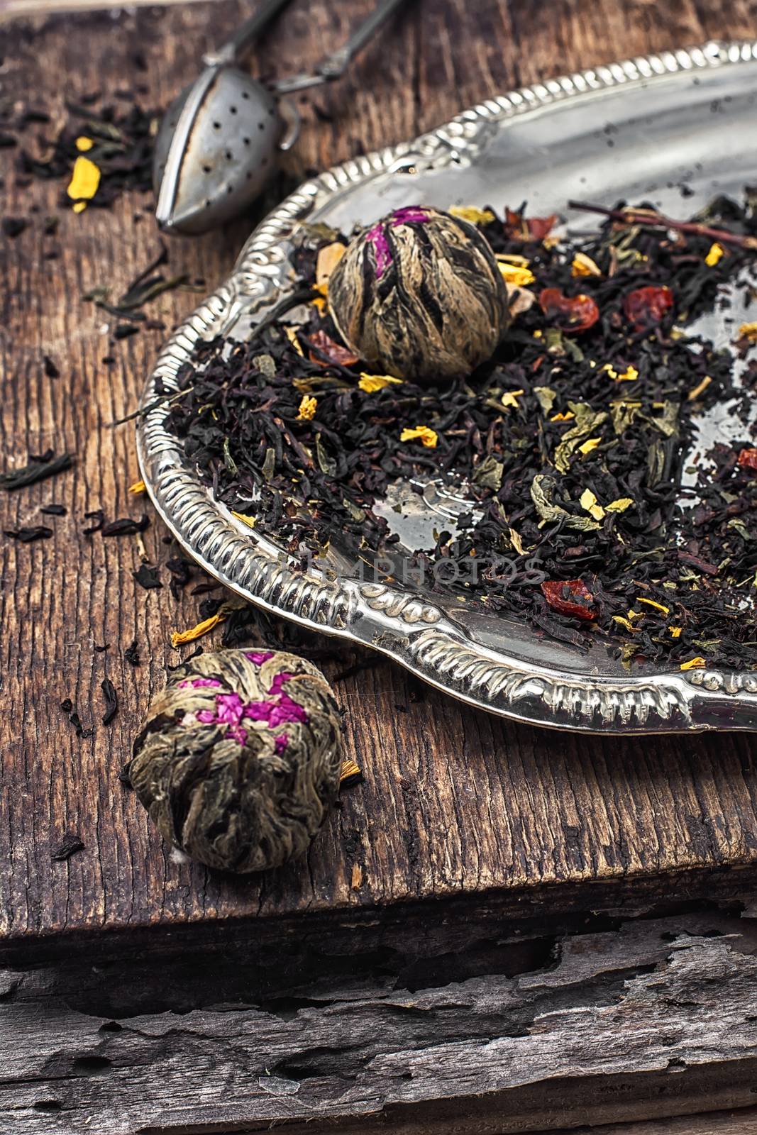 dry tea brew spilled on wooden background.Photo tinted.Selective focus