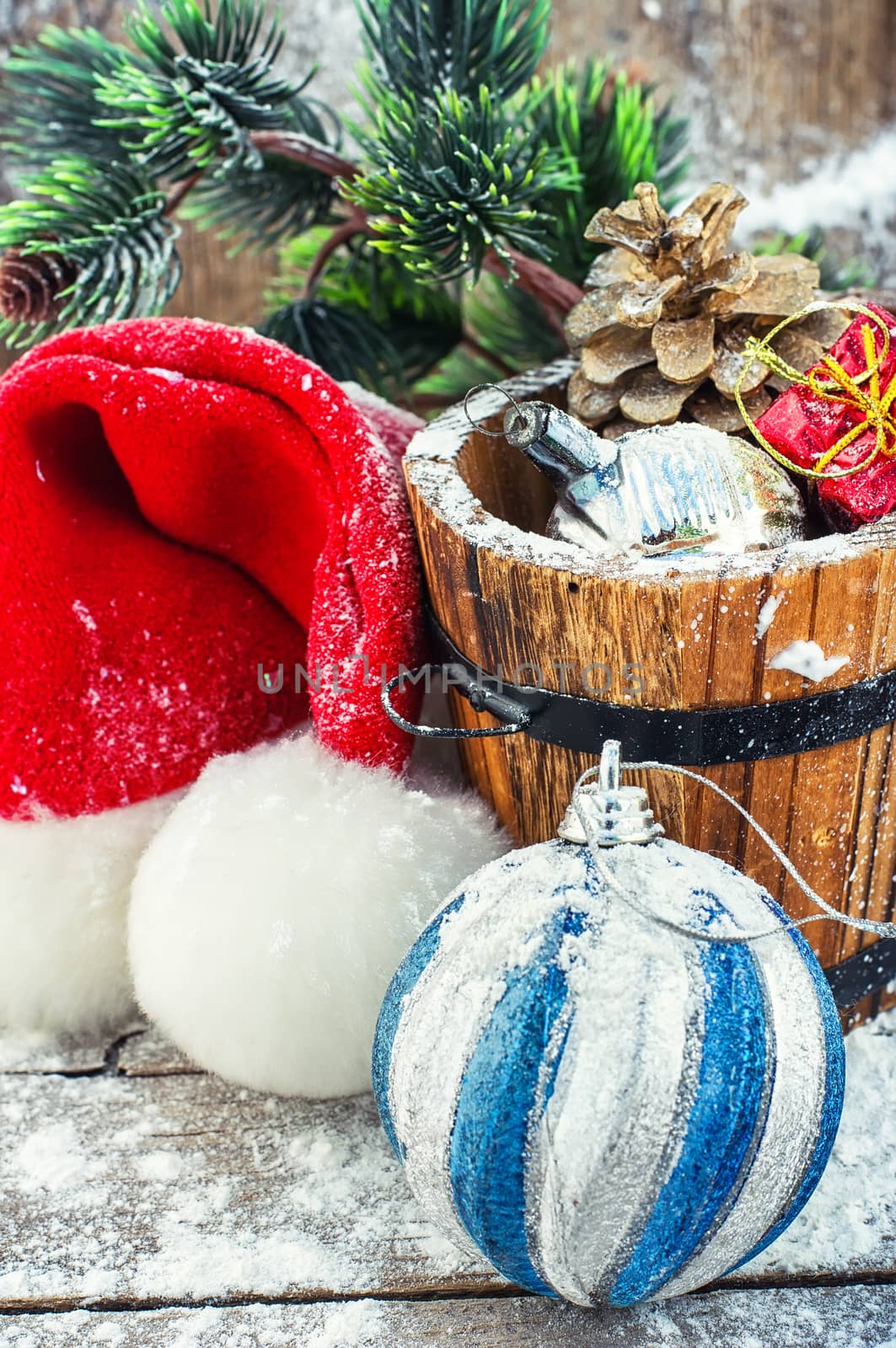 wooden tub with pine cones and Christmas decorations and ornaments.Selective focus