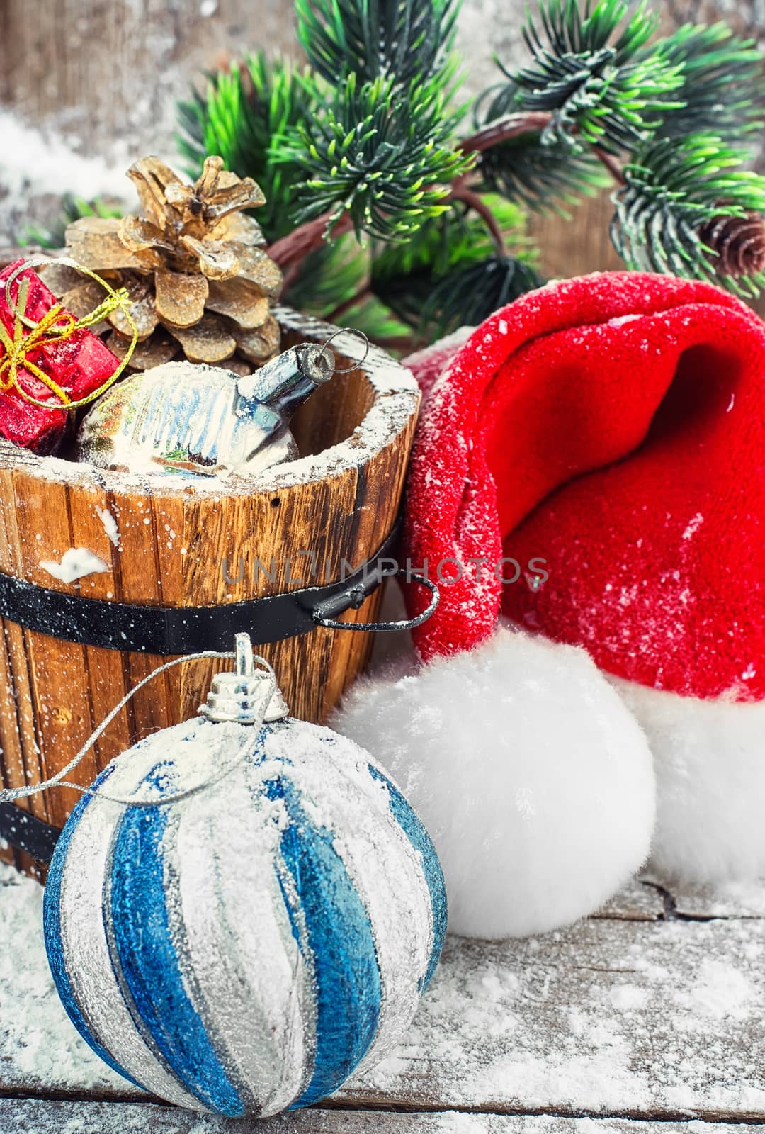 wooden tub with pine cones and Christmas decorations and ornaments.Selective focus