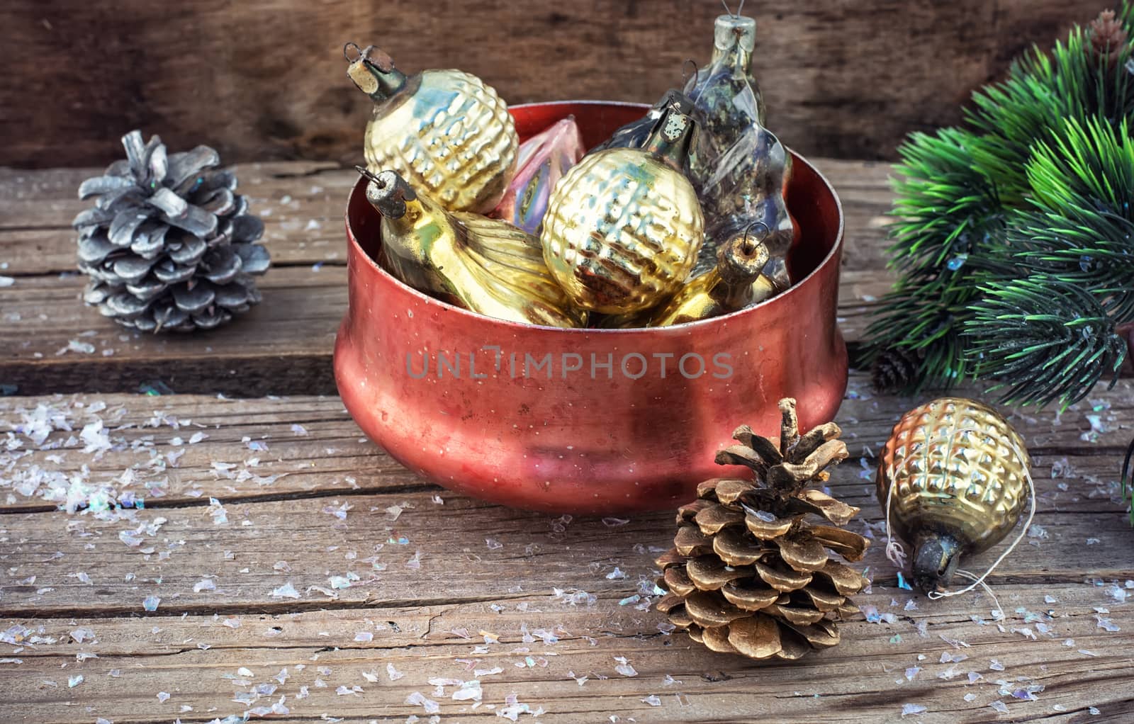 Festive Christmas decorations on wooden background in vintage style.Photo tinted.