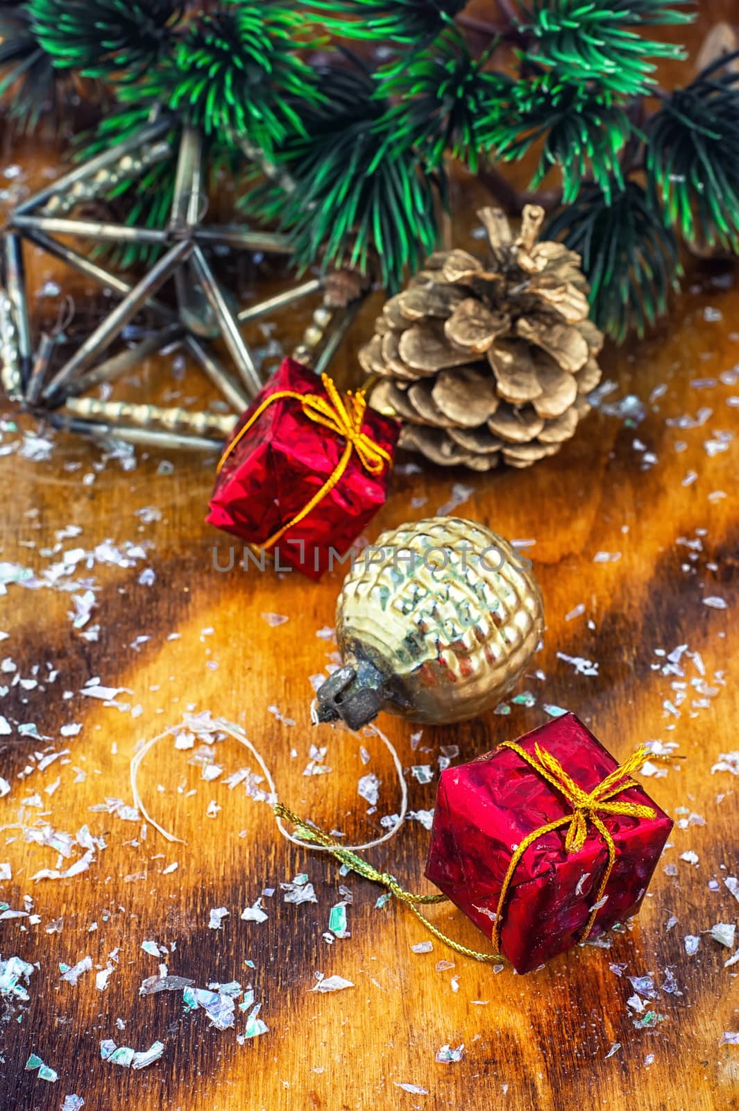 Festive Christmas decorations on wooden background in vintage style.Photo tinted.
