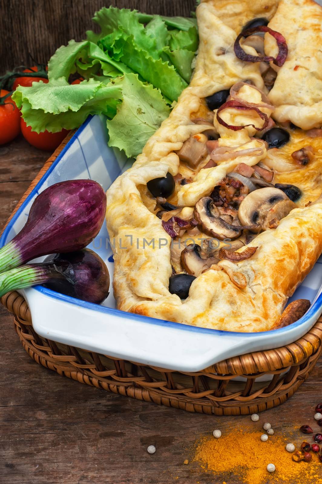 baked in the oven meat shawarma with vegetables in a rustic style.The image is tinted