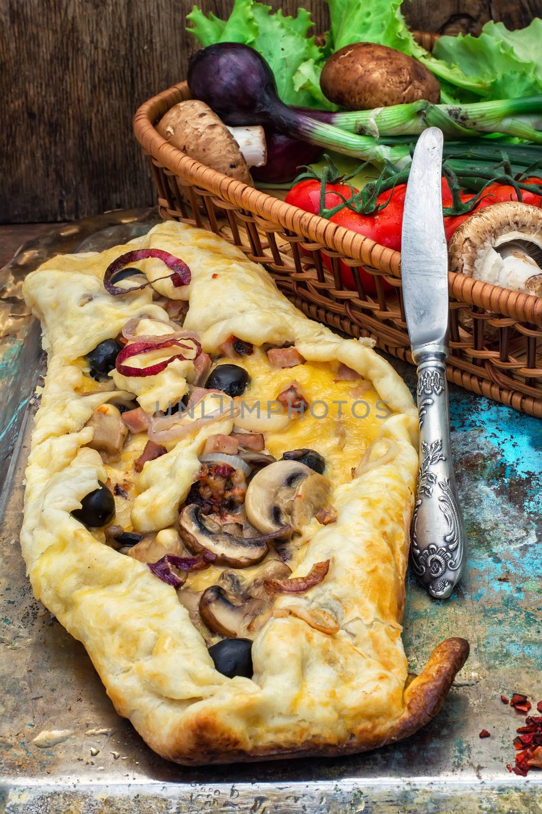 baked in the oven meat shawarma with vegetables in a rustic style.The image is tinted